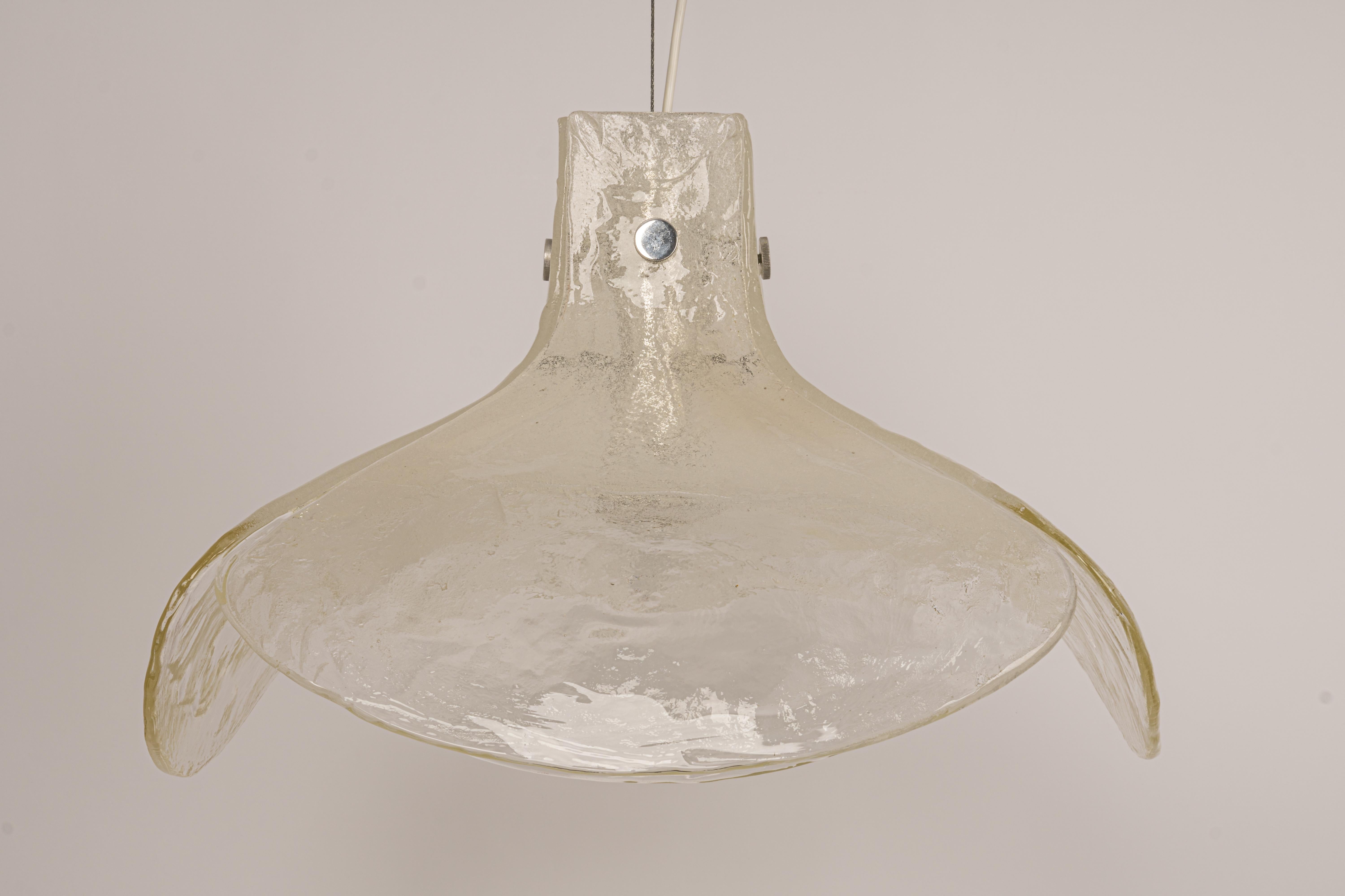A stunning large Murano white glass chandelier designed by Kalmar, Austria manufactured in the 1960s.
The chandelier is composed of 4 thick Murano glass elements attached to a metal frame.

High quality and in very good condition. Cleaned,