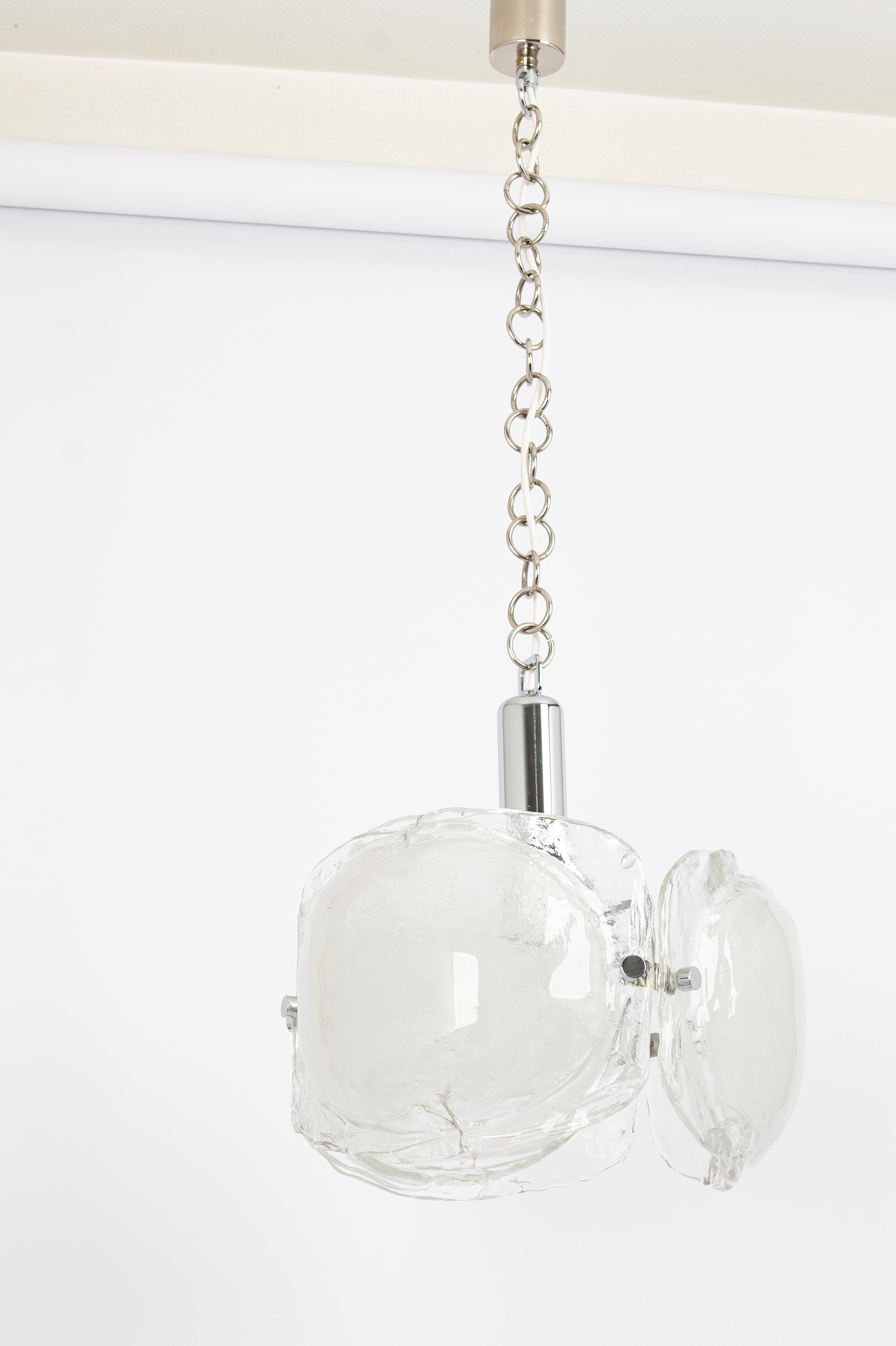 A stunning large Murano glass chandelier designed by Kaiser, Germany manufactured in the 1960s.
The chandelier is composed of 3 thick Murano glass elements attached to a chrome metal frame.

High quality and in very good condition. Cleaned,