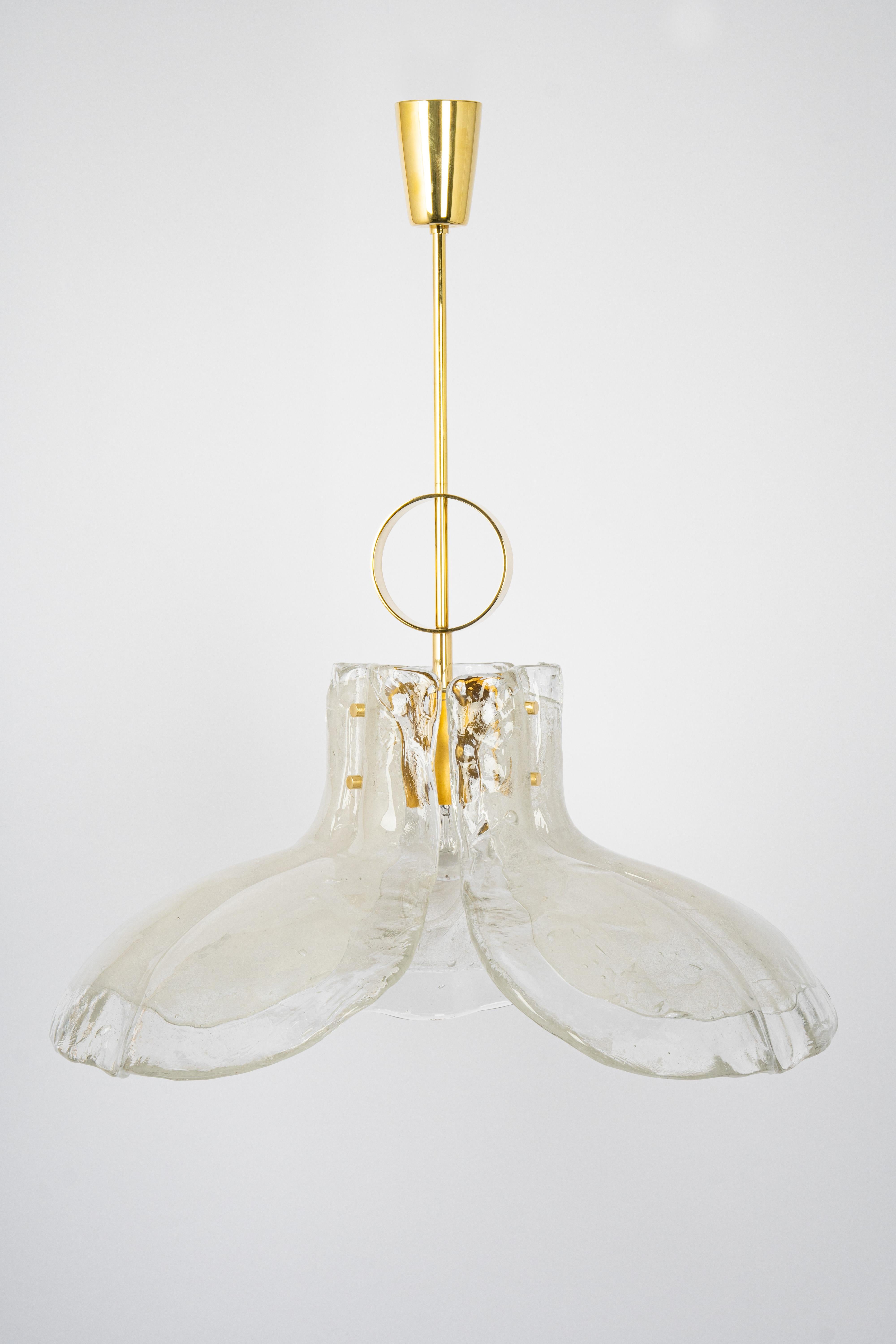 A stunning Murano white clear glass chandelier designed by Kalmar, Austria manufactured in the 1960s.
The chandelier is composed of 3 thick Murano glass elements attached to a metal frame.

High quality and in very good condition. Cleaned,