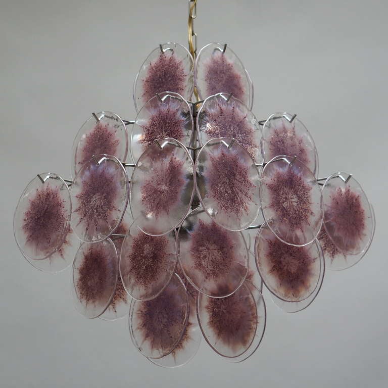 Italian Murano glass chandelier with 36 purple discs.
Measures: Diameter 48 cm.
Height 57 cm.
Total height including the chain 100 cm.