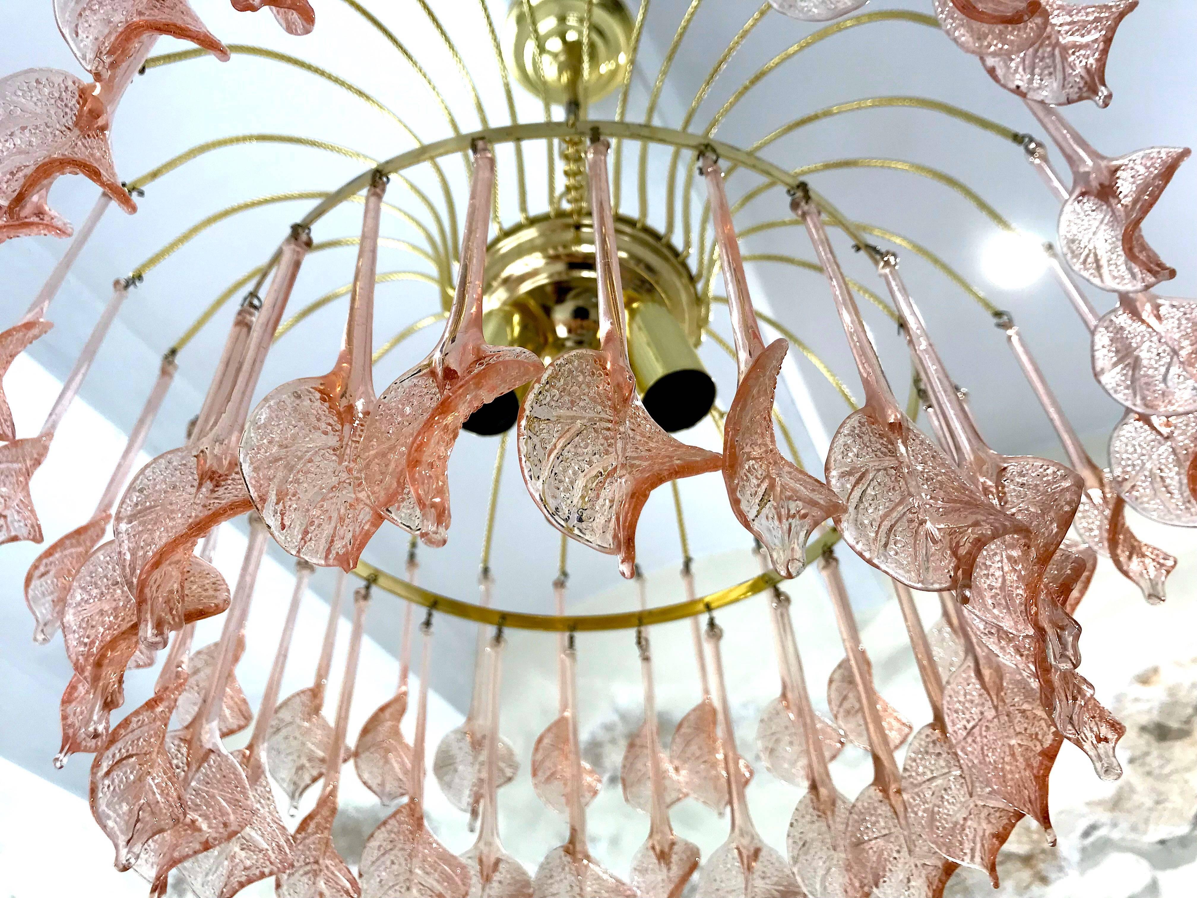 Very elegant and great quality, vintage midcentury chandelier. This piece has a gilt brass frame with Murano crystals large pink blossoms. Two level of Blossom crystal 
 In very good working condition.
