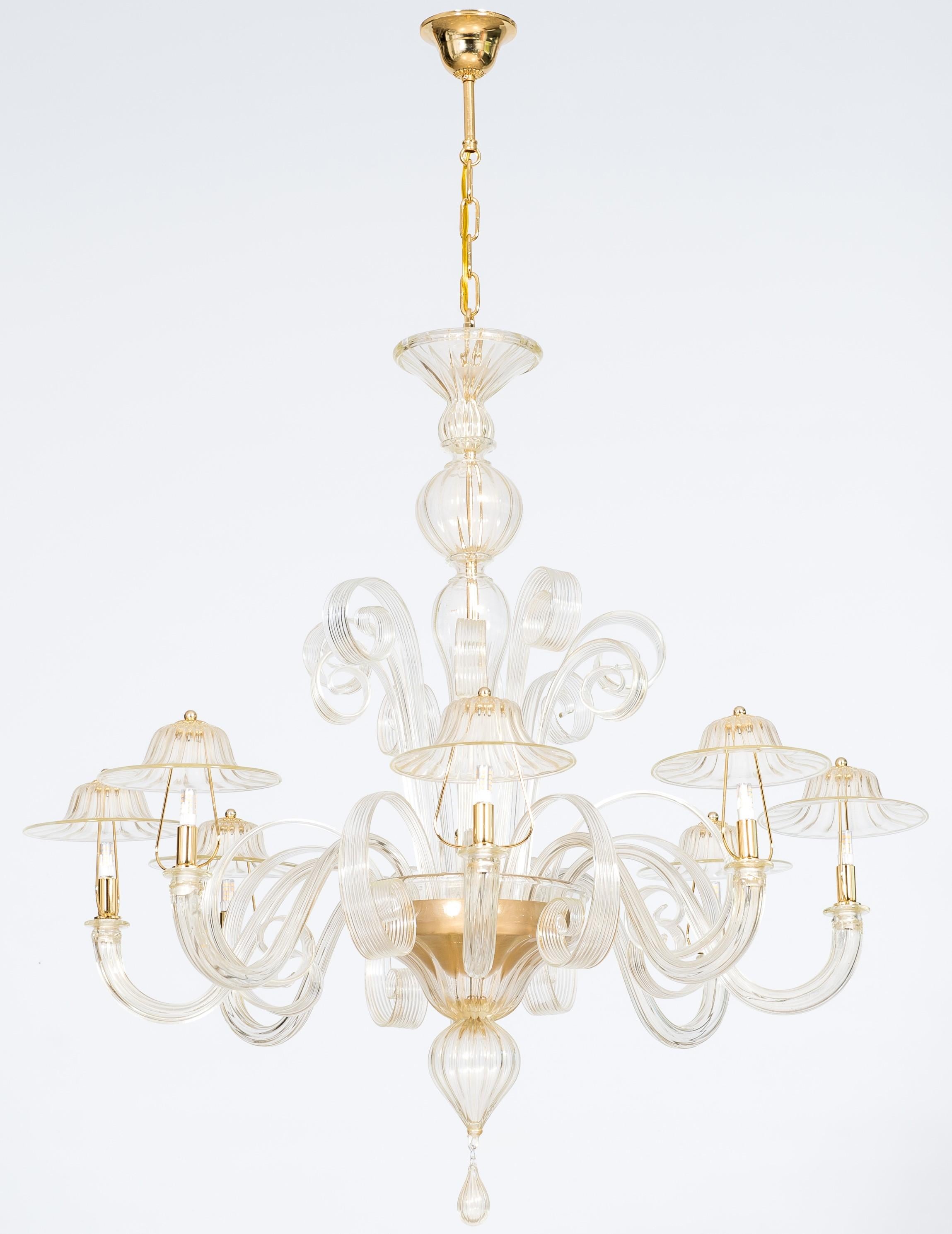 Murano glass chandelier with 24-Karat Gold and Pastoral Decorations, Italy.
This enchanting and unique chandelier is a superb example of the Murano glass century-old art. 
Its 37.5” height can be extended up to an additional 13.5” (51” in total)