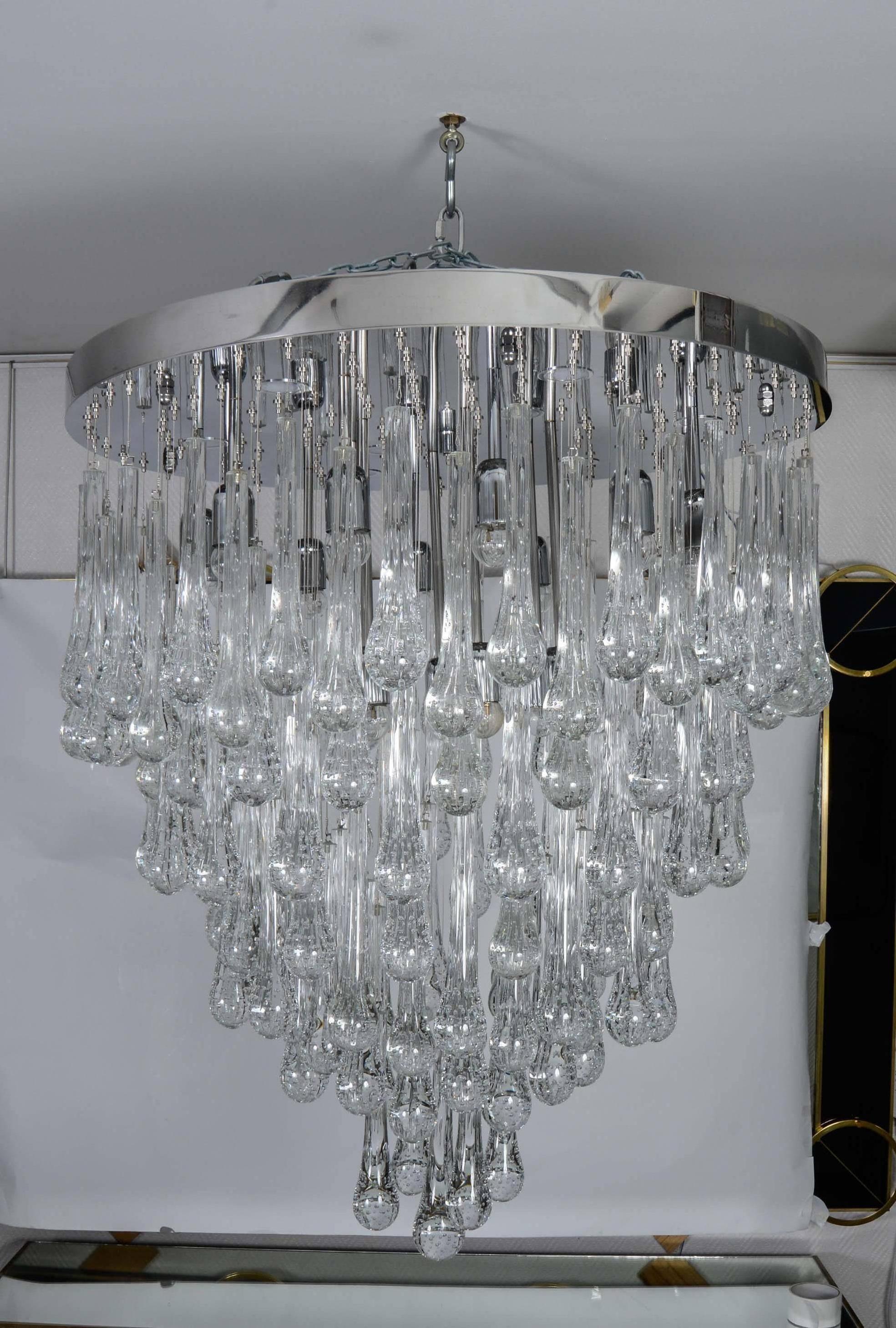 Murano glass chandelier with led bulbs and device for adjusting glass color.
