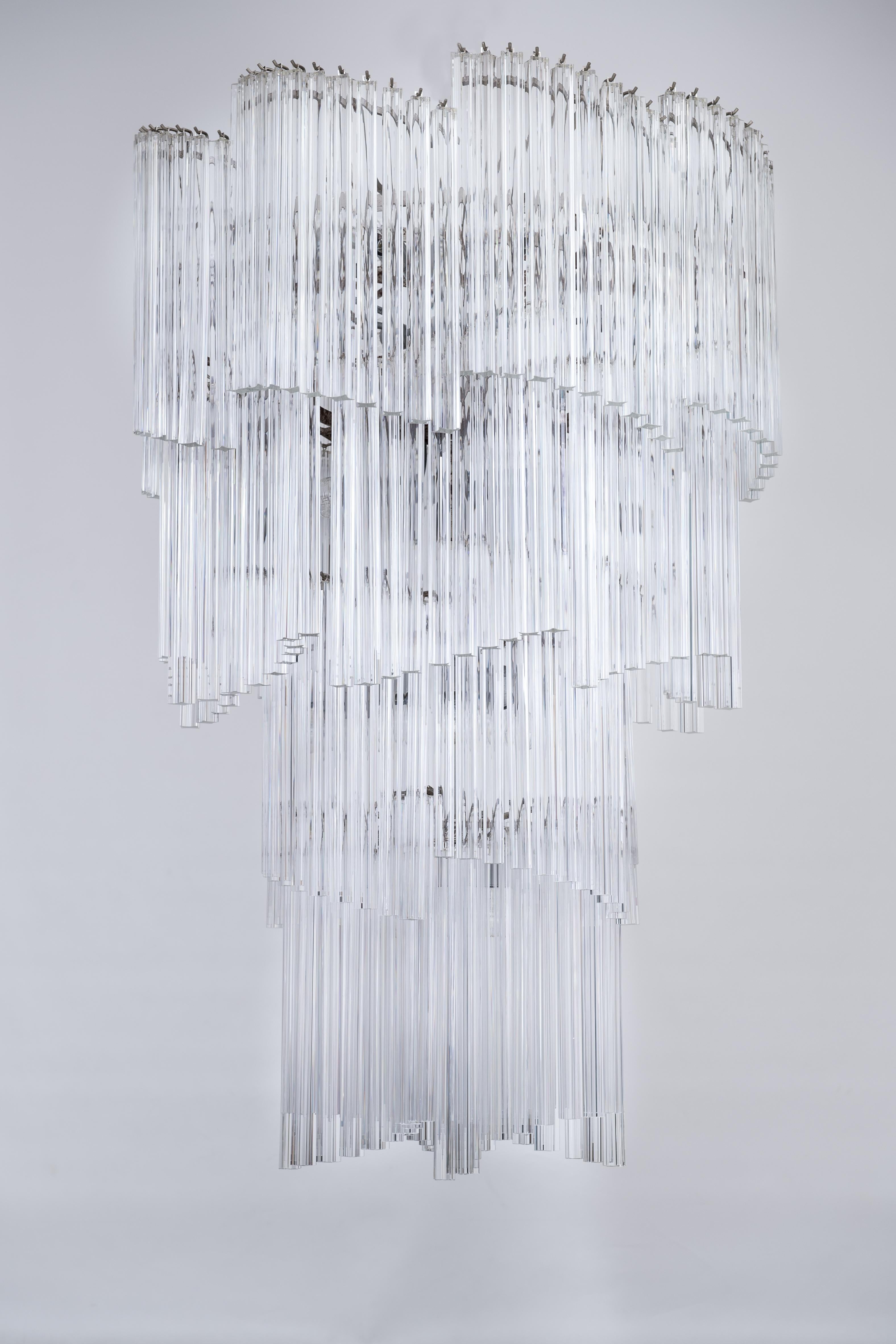This captivating Murano Glass Chandelier, crafted by Vintage Murano Gallery in the 1970s, is a stunning example of Italian design and artisanal excellence. Adorned with numerous 