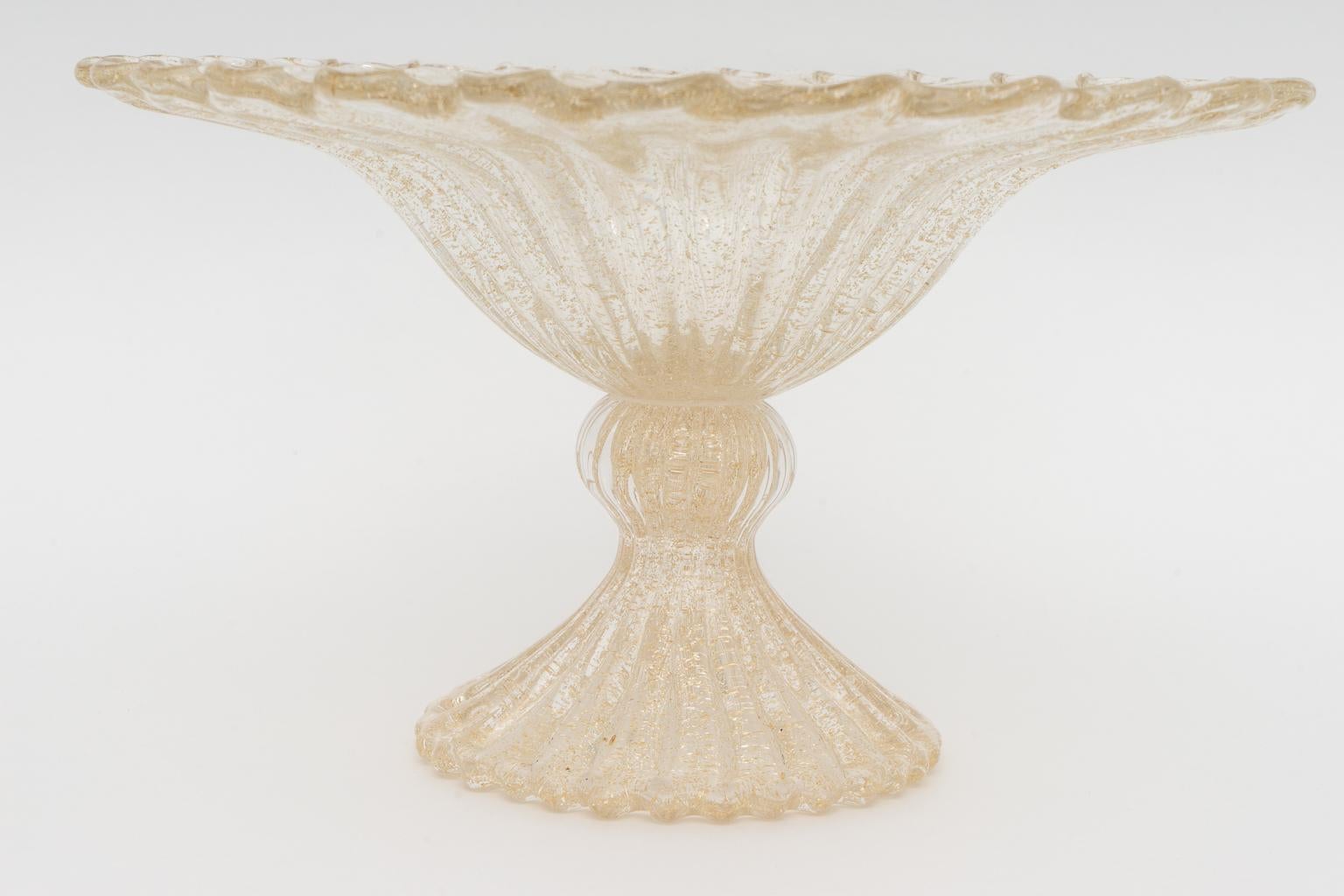This stylish Murano glass compote was acquired from a Palm Beach estate and is in the style of pieces created by Barovier et Toso and it could be used for a floral arrangement, to hold fruits and simply as an object of beauty.