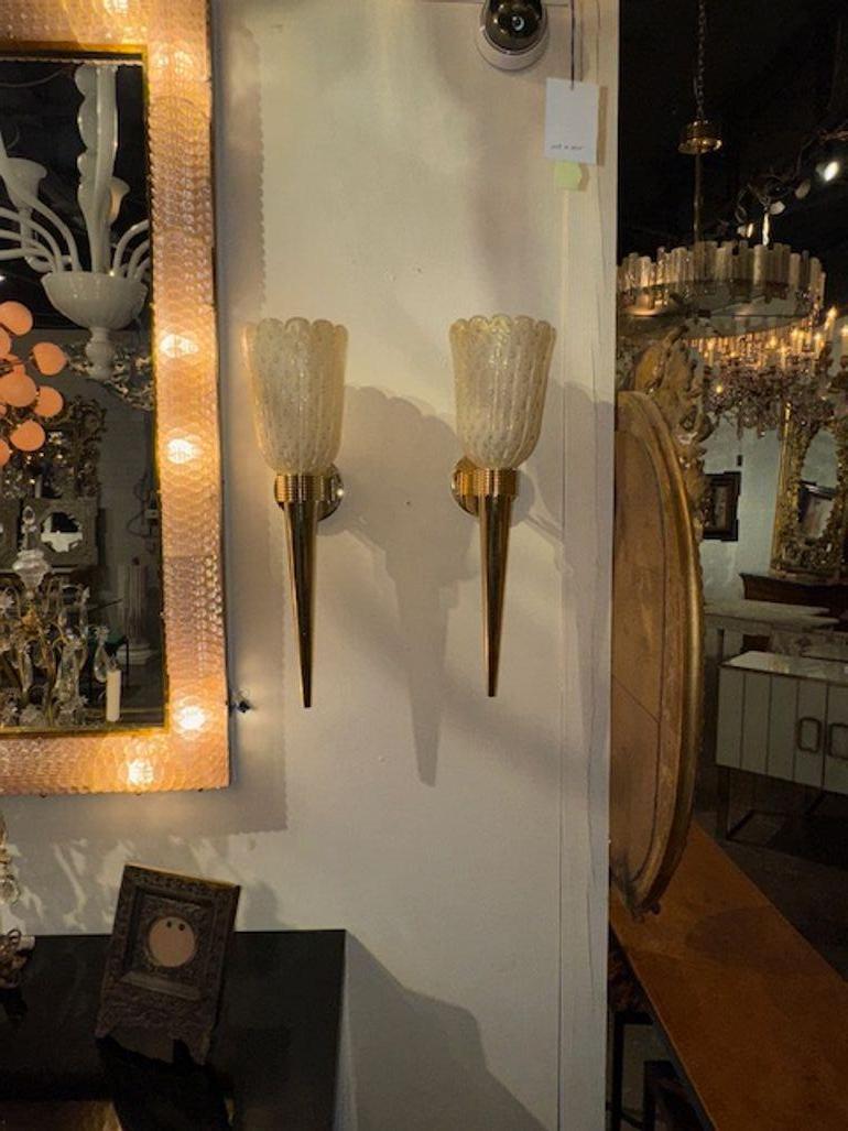 Pair of modern Murano Glass and brass cone form sconces. Circa 2000. The sconces have been professionally rewired and ready to hang. 23hx 7w x 8.5d