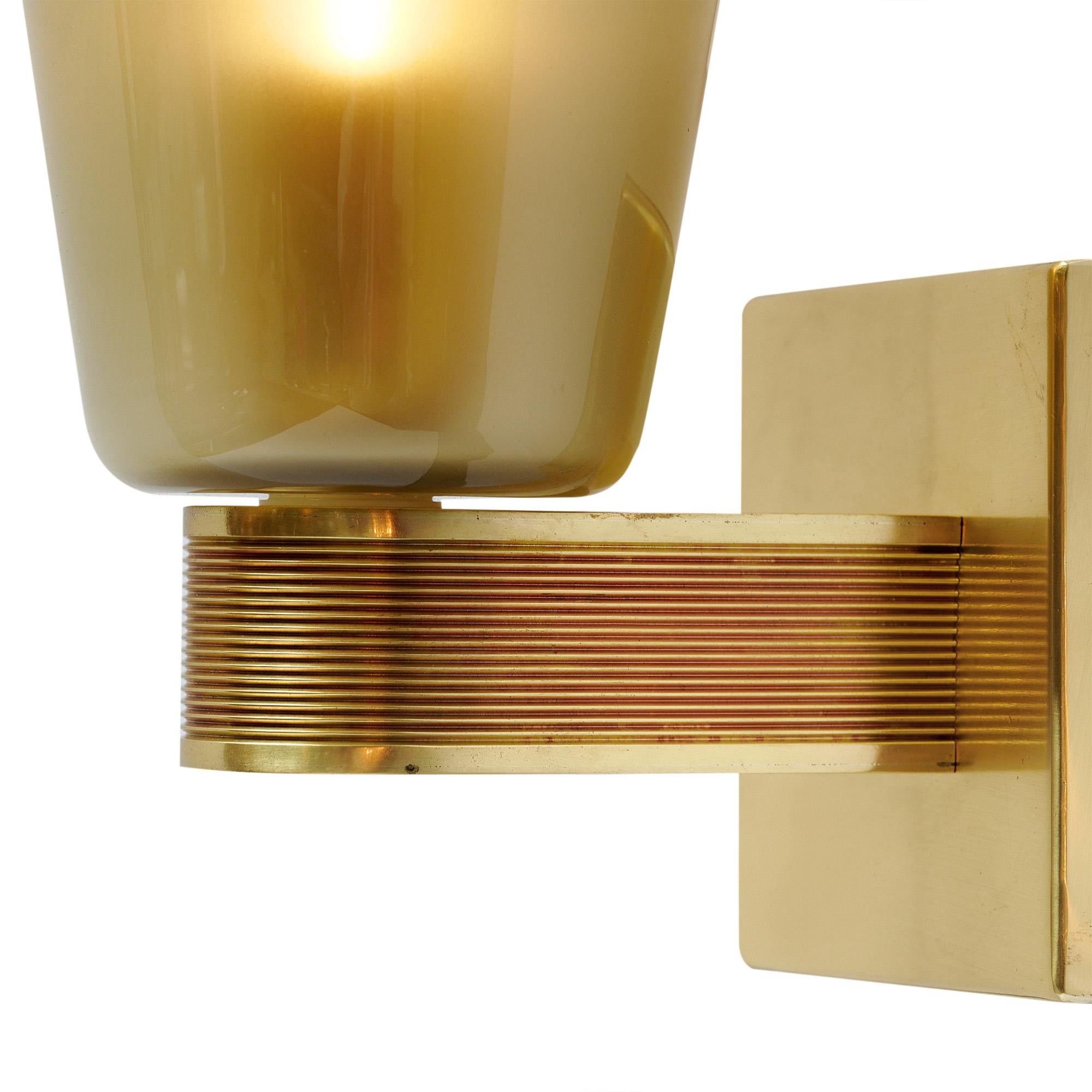 Pair of sconces from Murano, Italy outside of Venice. Each sconce features a hand-blown cone of glass in a frosted gray tone. The glass is supported by a brass structure. This pair has been newly wired to fit US standards and is in very nice