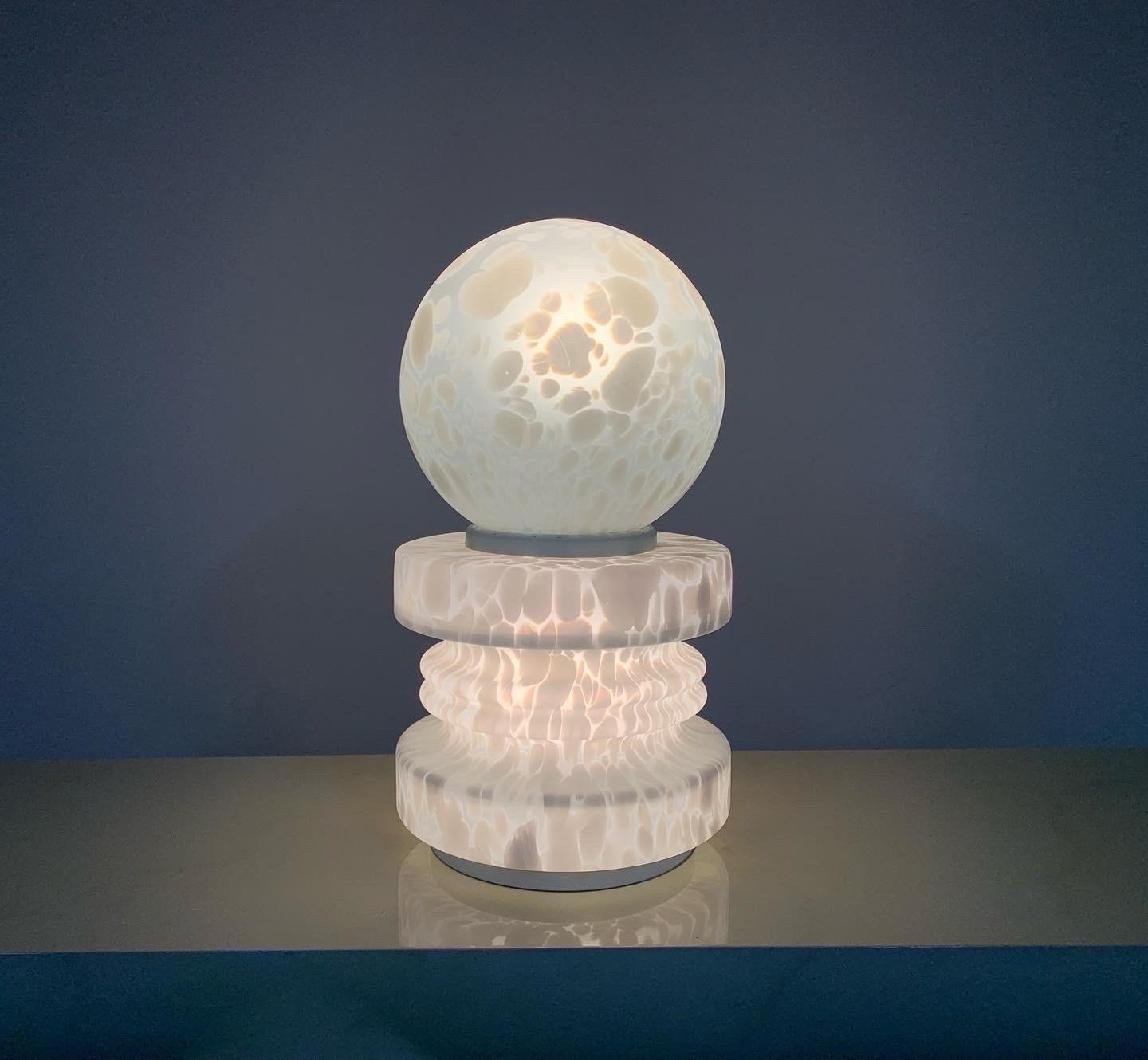 A beautiful Murano glass lamp by Mazzega and designed by Carlos Nason having cumulus form and standing a monumental 22.5” with a diameter of 12”. 
Very nice overall condition. The glass is perfect with the metal supports having some rubs as shown in