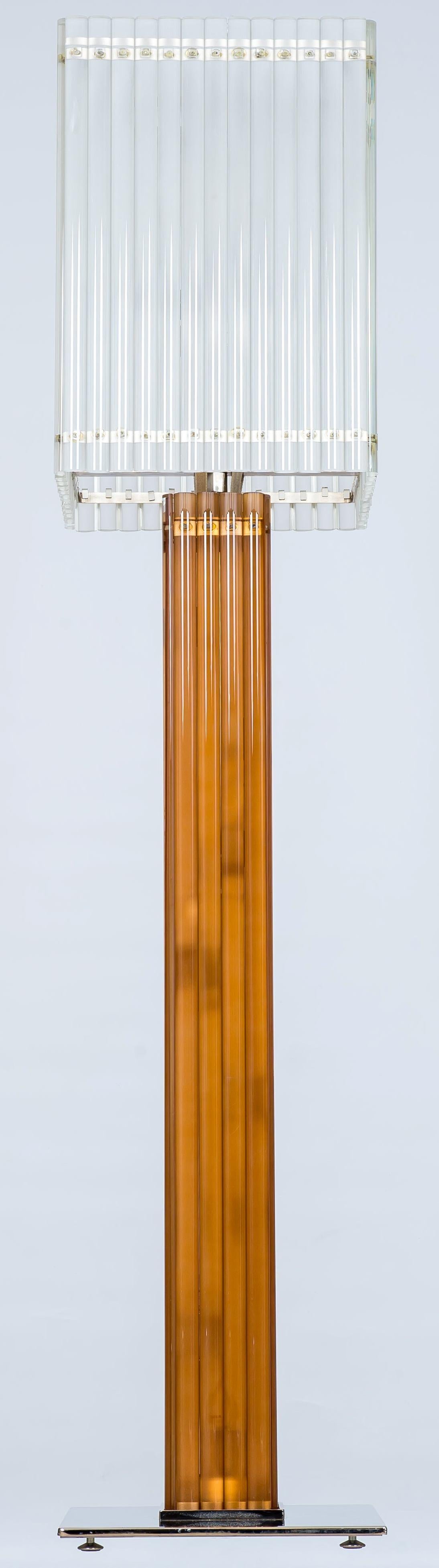 Murano glass deco floor lamp with sandblast and amber color, Italy
This astonishing Murano glass floor  lamp is made of two larger geometrical elements in two different colors and proportions. The two elements enact an enchanting interplay of colors