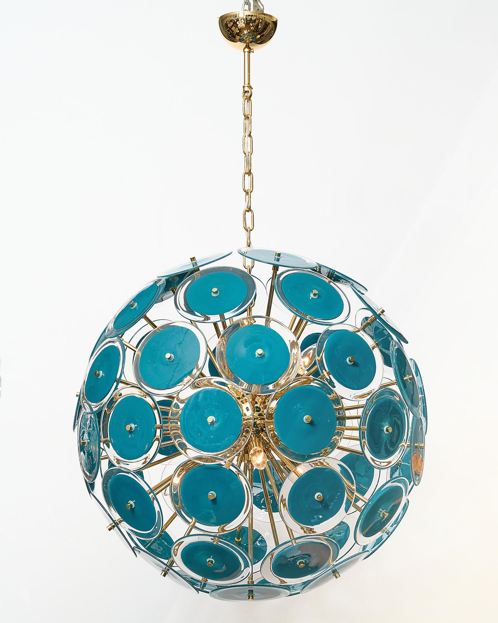 Murano glass chandelier in the sputnik shape with beautiful hand-blown glass discs. Each disc element has opaque teal blue glass rimmed with clear glass. It has been newly wired to fit US standards.