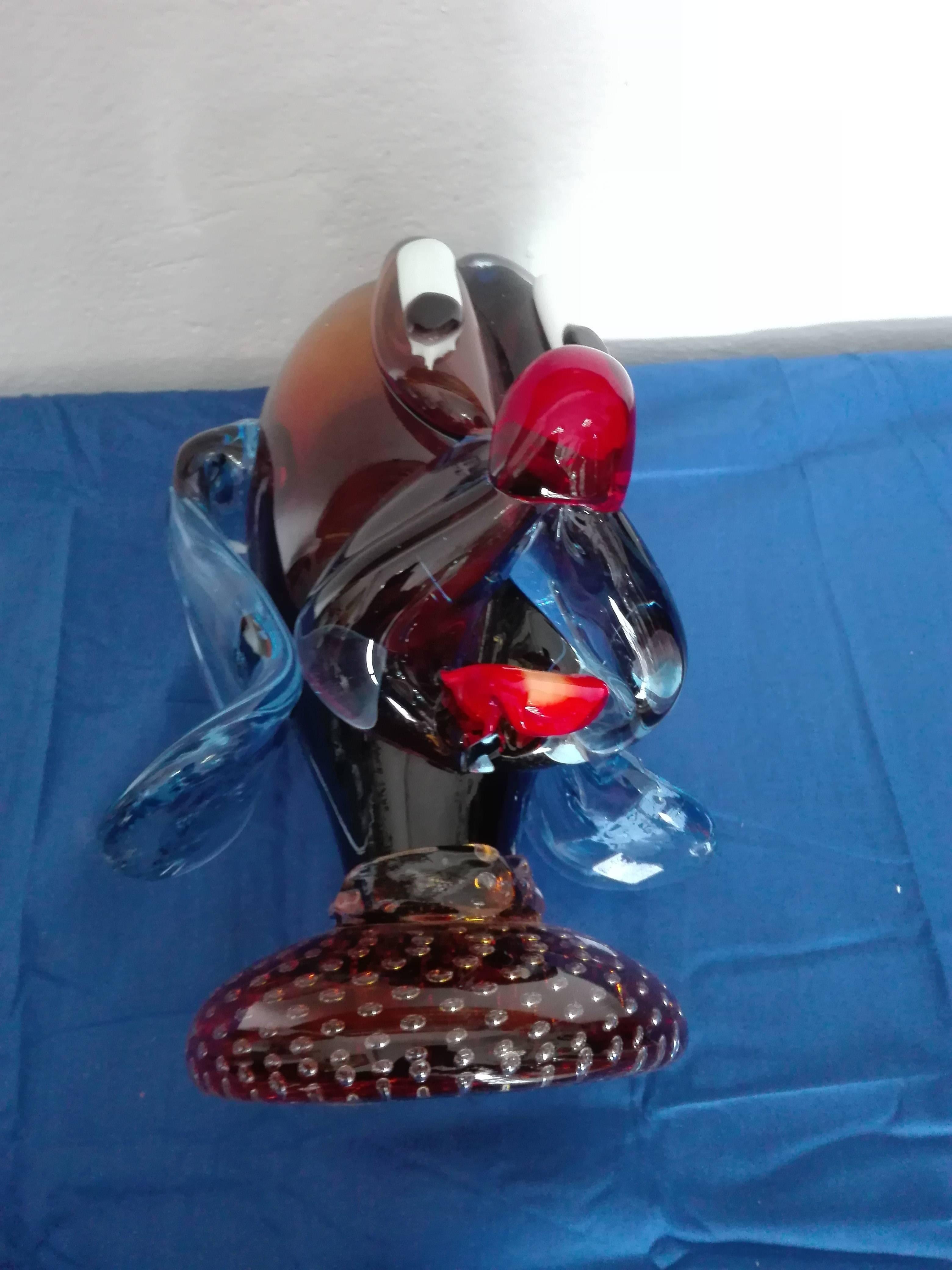 Perfect condition, free-from any kind of damage. The head is attached to a glass base.