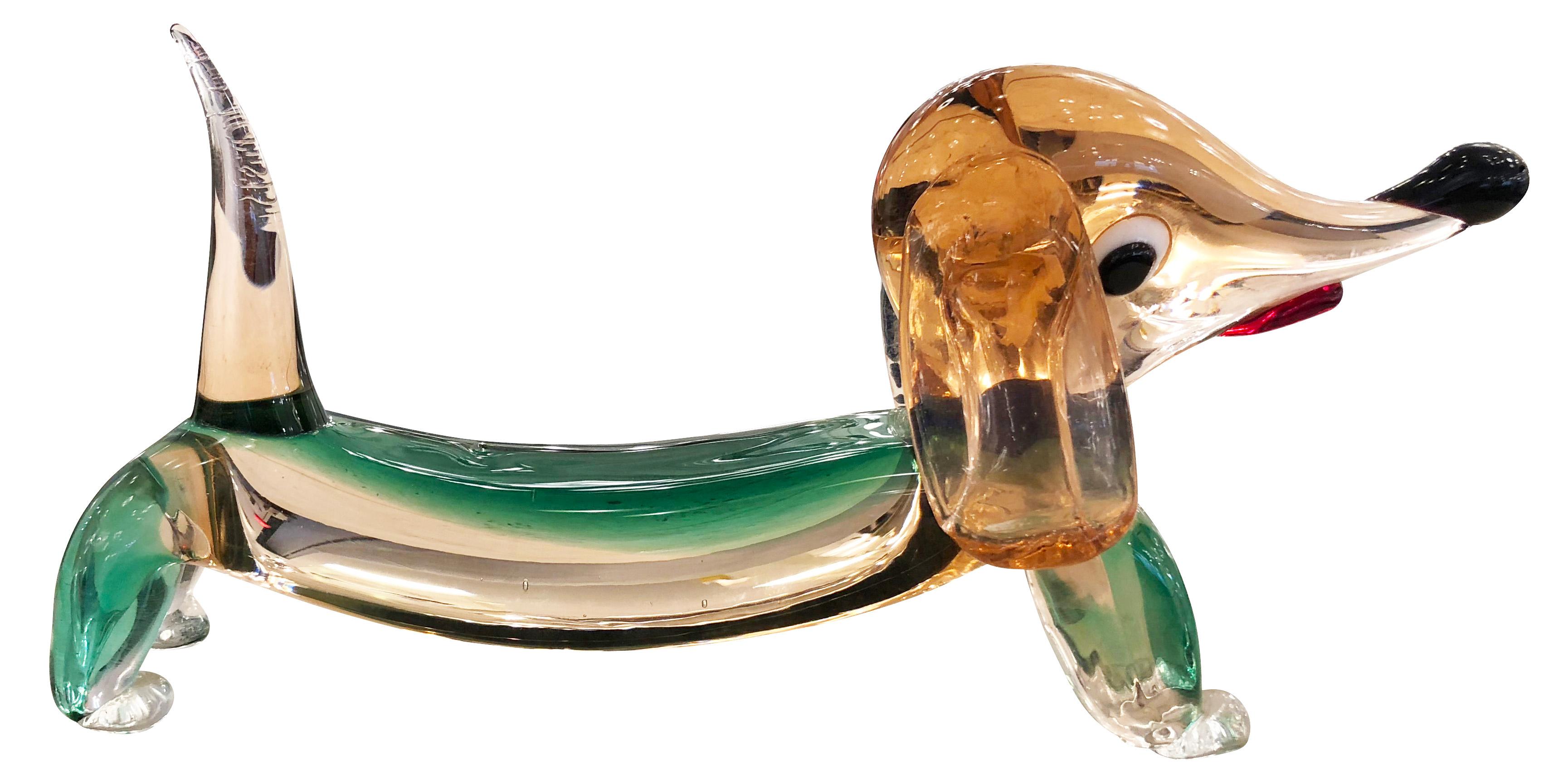 Playful Murano glass sculpture from the 1960s representing a dachshund. 

Condition: Excellent vintage condition, minor wear consistent with age and use

Measures: Width: 11.5”

Depth: 4.5”

Height: 5”.

