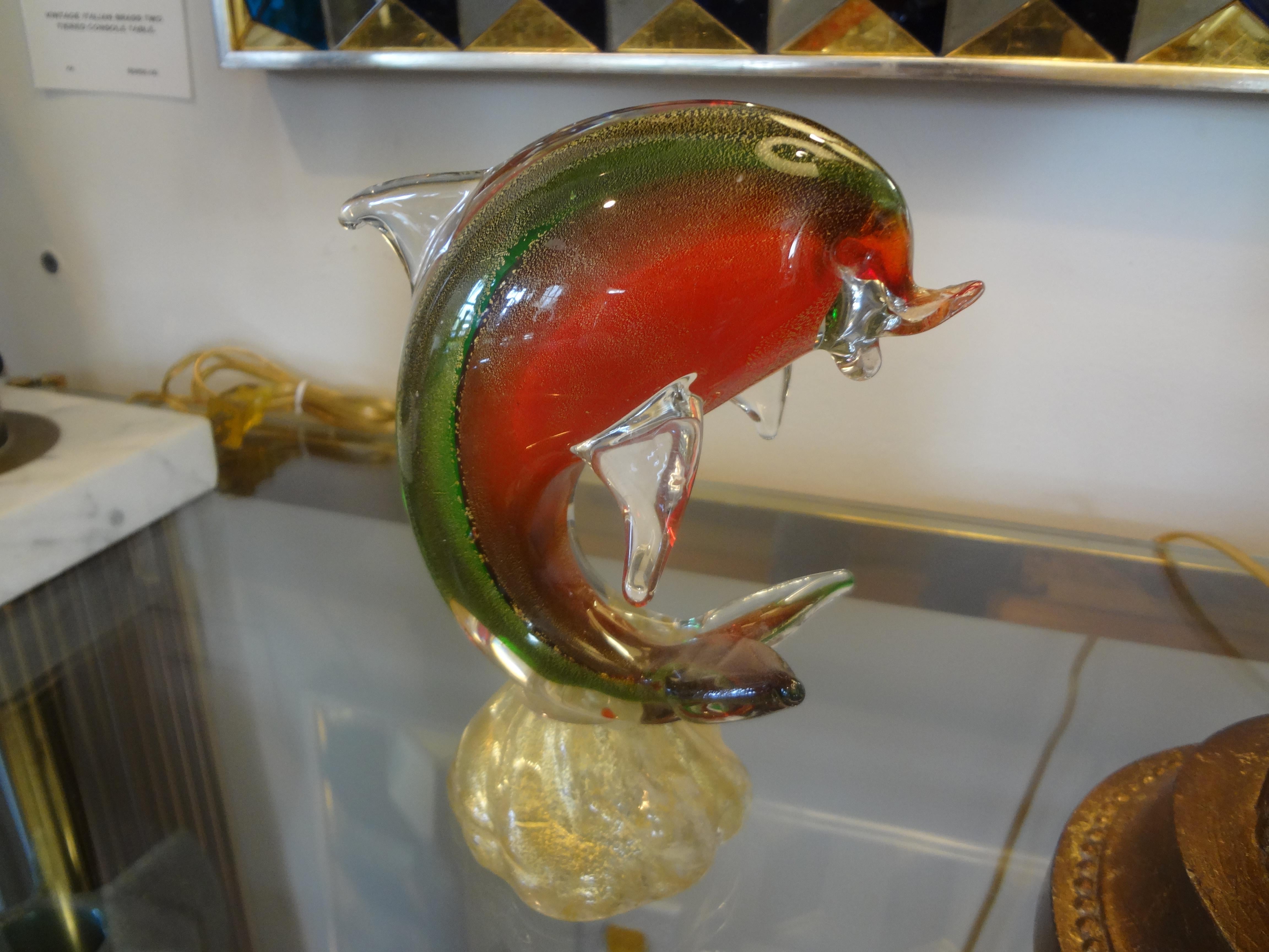 Murano glass dolphin attributed to Barbini. This beautiful colorful dolphin figure or sculpture is hand blown with gold inclusions. Stunning!
