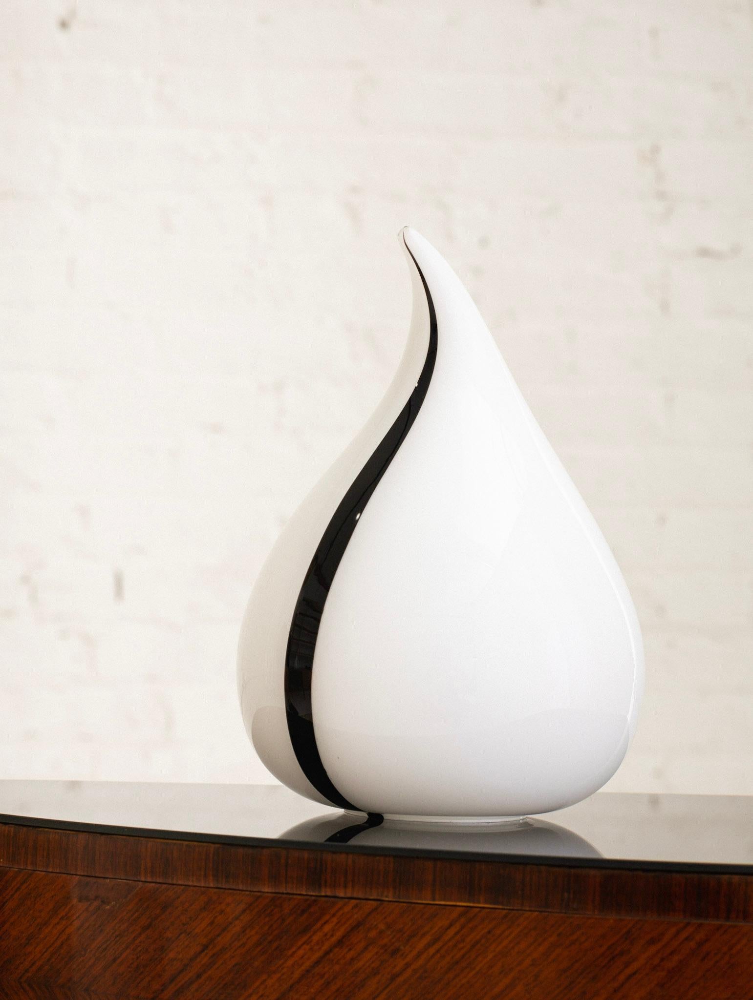 Murano glass drip or tear drop form table lamp. White color with black stripe detail. Sourced in Milan, Italy. Pair available, sold separately.