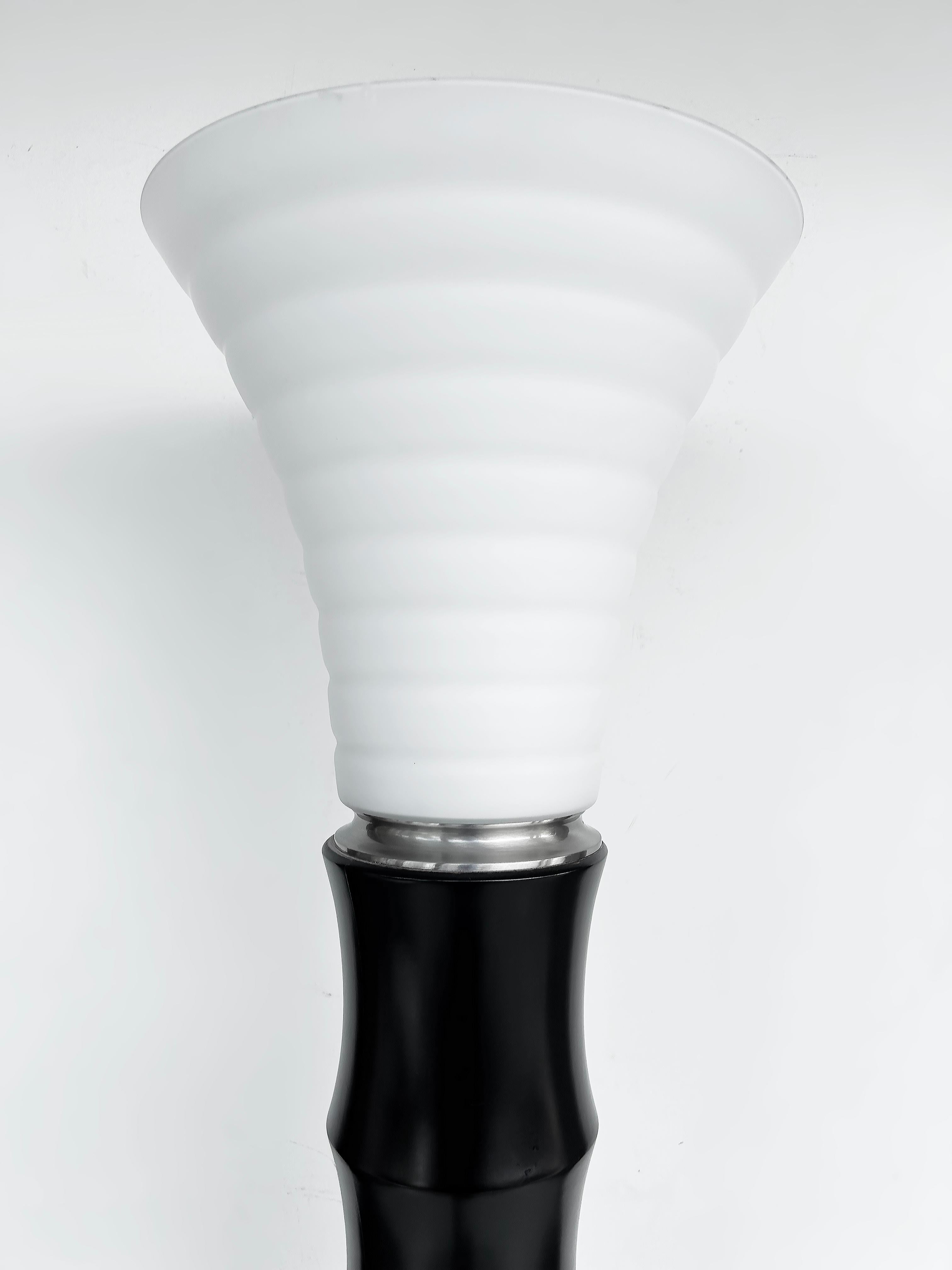 Murano Glass, Faux Bamboo Wood Torchère Floor Lamp, Italy

Offered for sale in an Italian Murano glass faux bamboo ebonized wood and chrome torchère floor lamp.  The floor lamp is wired and in working condition.  The socket accommodates a single