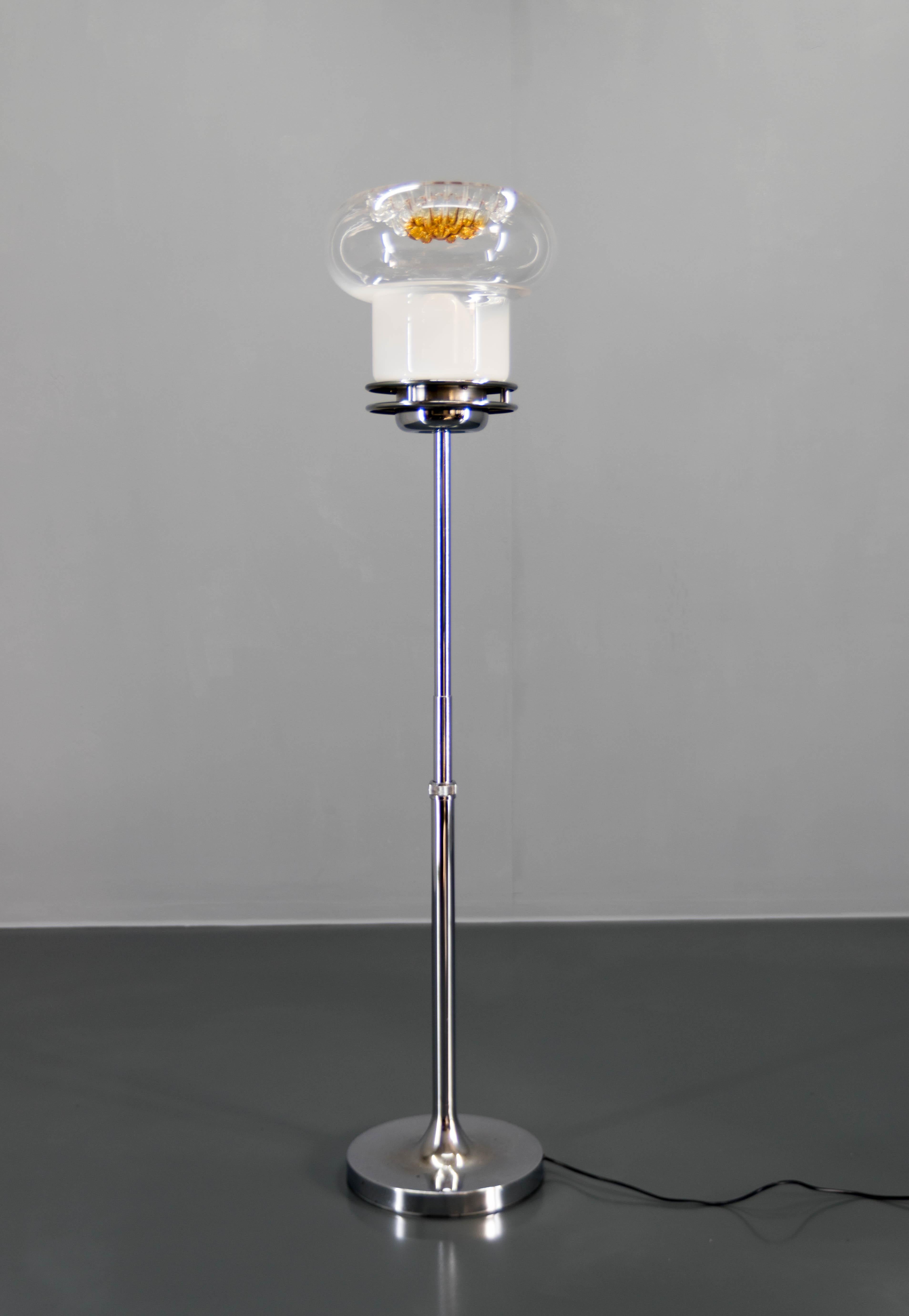 Floor lamp made in Italy in 1980s.
Chrome and steel stand and Murano glass shade.
Chrome with minimum age patina.
Glass in a perfect condition.
Rewired:
1x60W, E25-E27 bulb
US plug adapter included