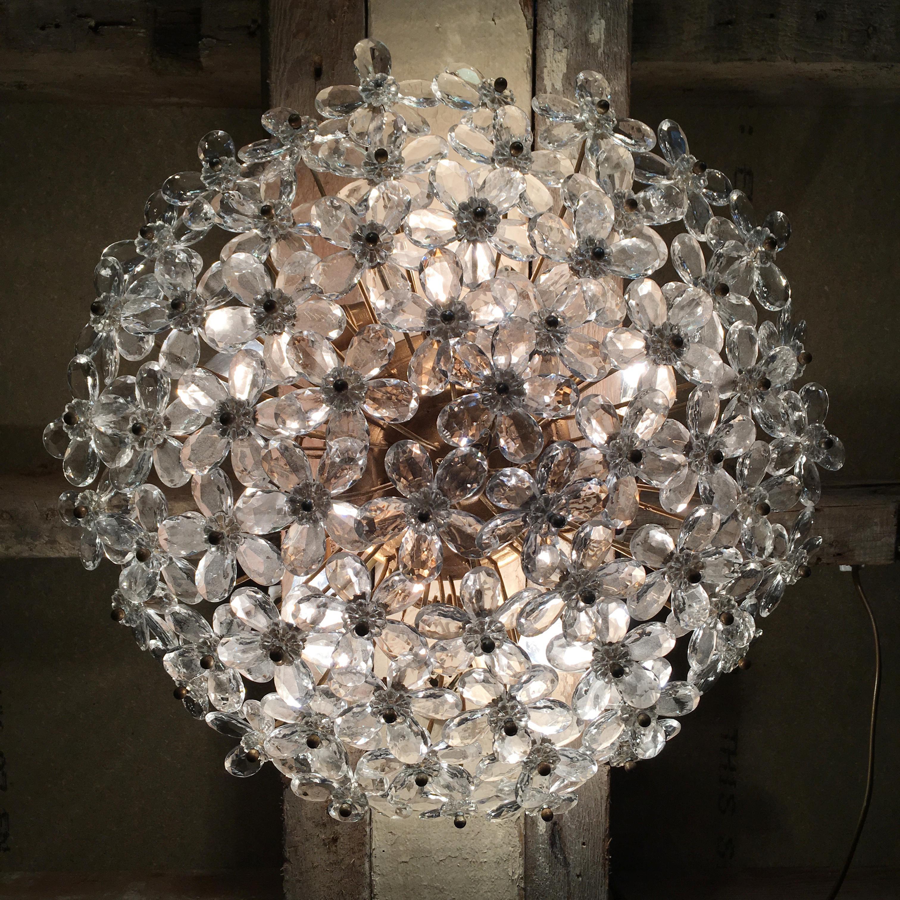 Huge Murano glass flush light

This beautiful light from the 1960s is packed full of crystal cut faceted clear glass flowers on stems forming a sparkling dome

The light is heavy and attaches to the ceiling with a hook fixture on the rose
the
