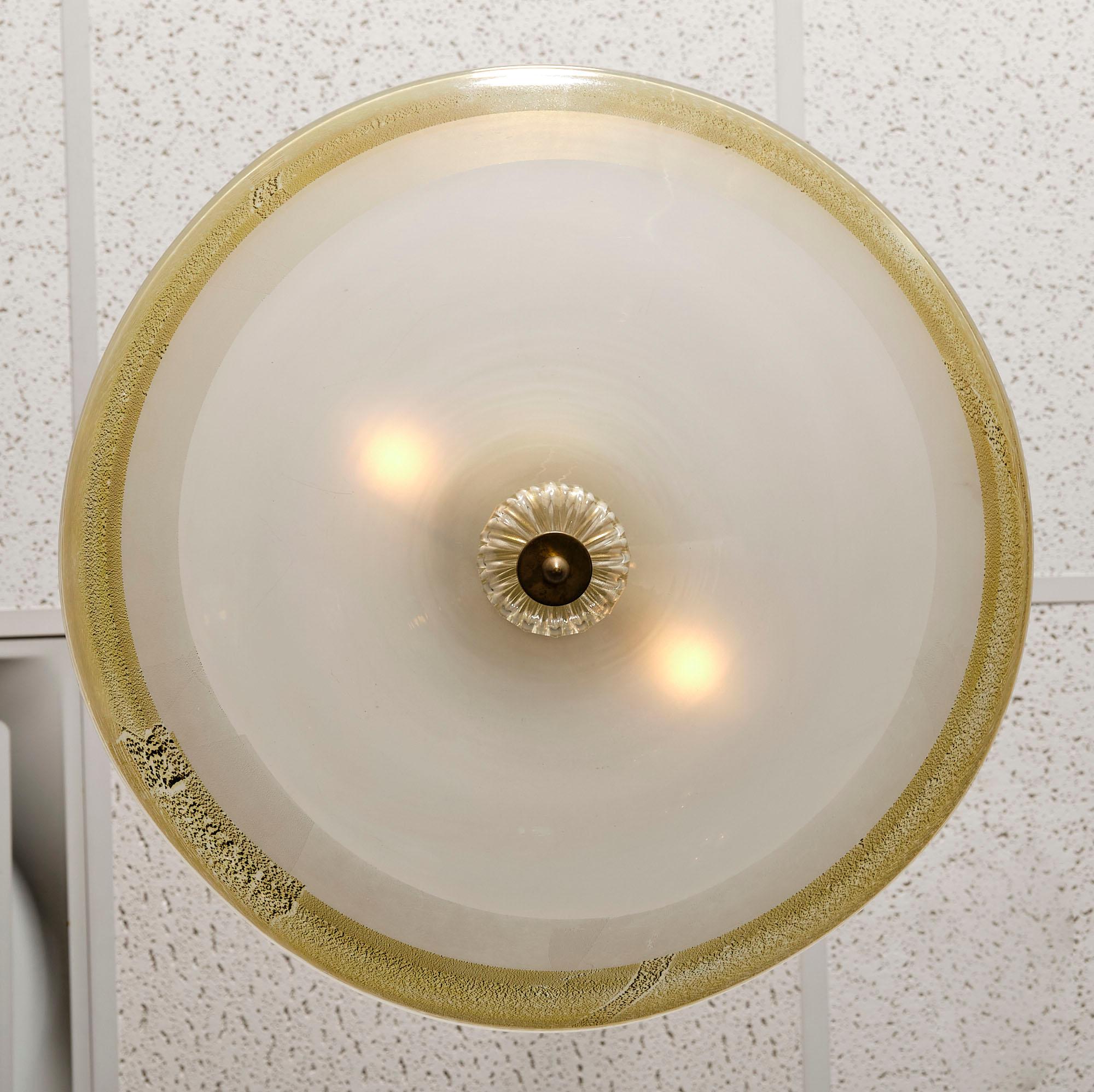 Ceiling fixture from the island of Murano made of opaline glass fixed with 24 carat gold leaf. There is a beautiful ridged glass finial. This piece has two medium base bulbs.