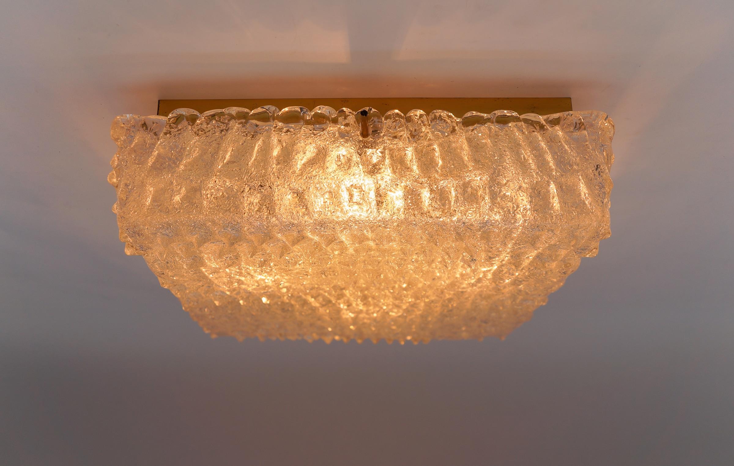 Stunning Murano Glass Flush Mount Lamp with Crocodile Skin Surface Texture by Hillebrand 1960s, Germany

The lamp is executed with 5x E14 Edison screw fit bulbs. It is wired and in working condition. It runs both on 110 / 230 volt.

Our lamps are