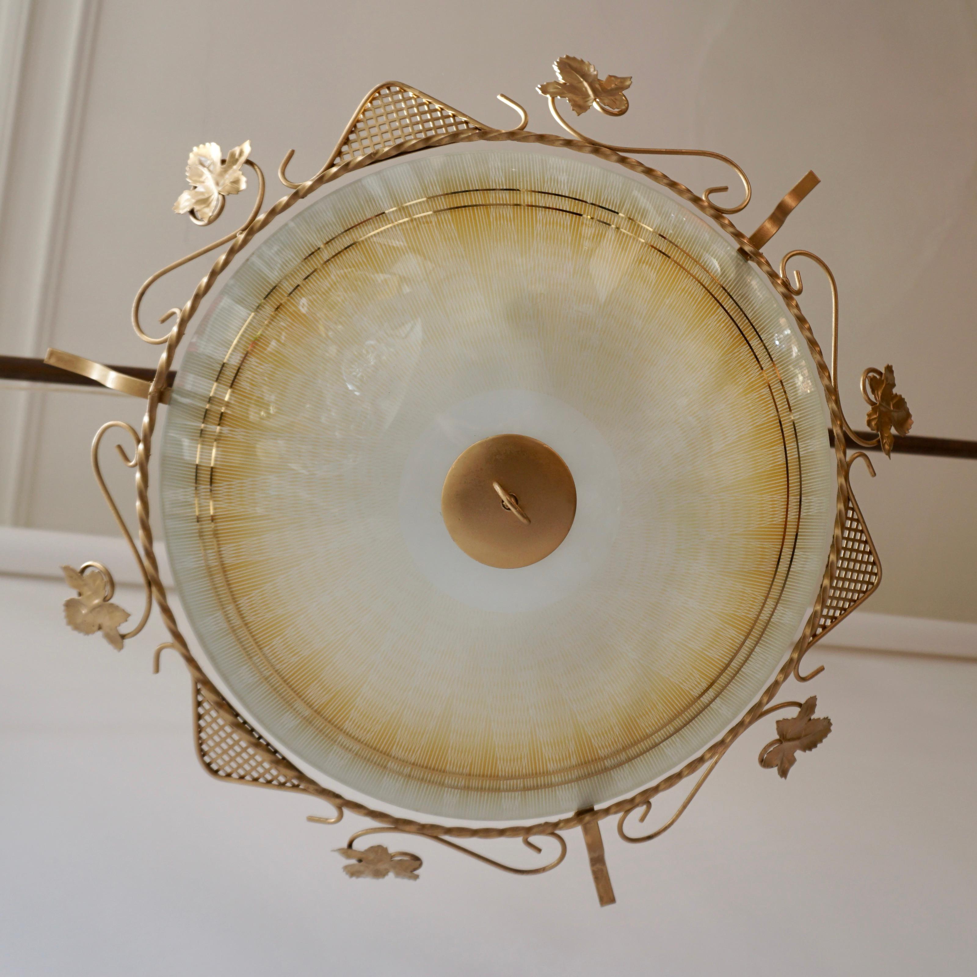 Large and elegant Mid-Century Modern Sputnik flush mount or wall lamp. Manufactured probably in Murano in Italy, 1950s. 
The lamp is executed in opaline glass, and gilded metal. 
It needs 3 x E27 screw fit bulbs. It is wired, and in working