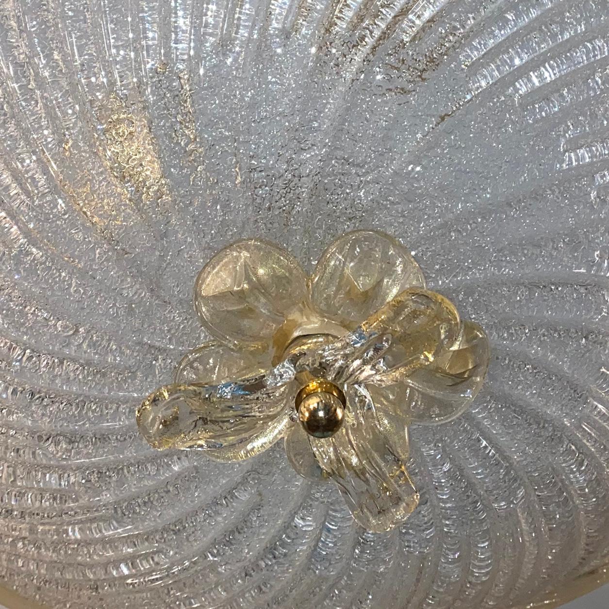 A circa 1940's Murano light fixture with clear and gold body and three interior lights.

Measurements:
Diameter: 24