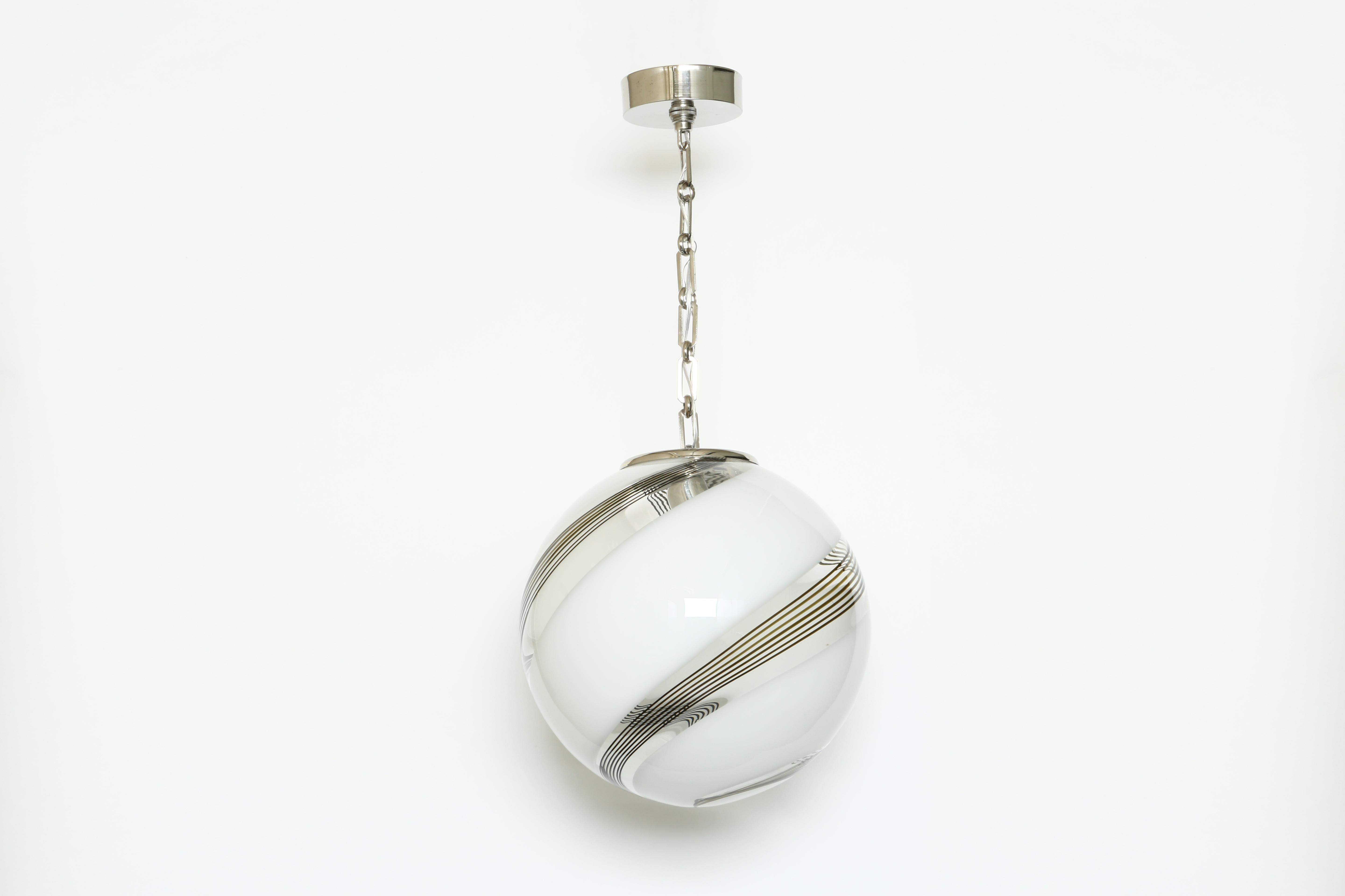 Murano glass globe ceiling pendant.
Glass, metal.
Italy, 1970s.

 