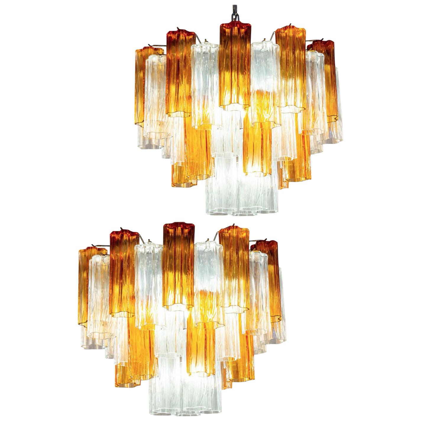 Amazing pair chandelier includes precious gold amber color and clear tronchi Murano glasses 20 cm long. Hight with chain and canopy cm 115 . Without  chain and canopy cm 45 (17,7