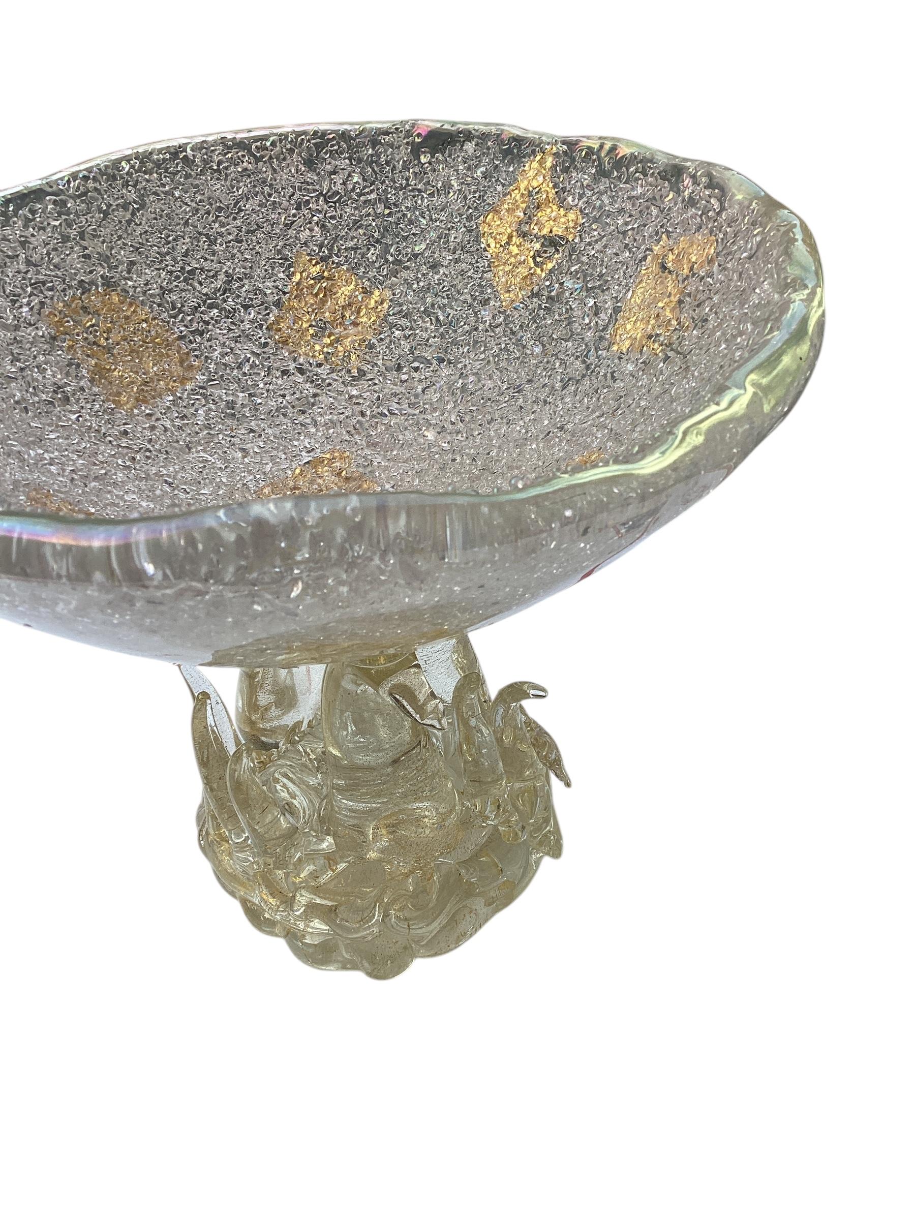 Vintage Murano hand blown gold flecks Italian art glass footed compote bowl. Attributed to designer Ercole Barovier for Barovier e Toso, circa 1950s. The bowl has a scalloped rim, with a textured interior with gold leaf decoration. The bowl is