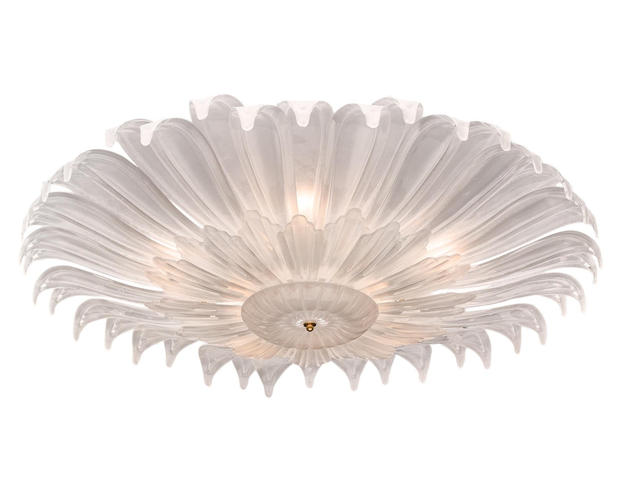 Large flush mount made of hand-blown glass petals from Murano, Italy. This flower shaped fixture has frosted glass that emanates from a central finial. It has been newly wired to fit US standards.