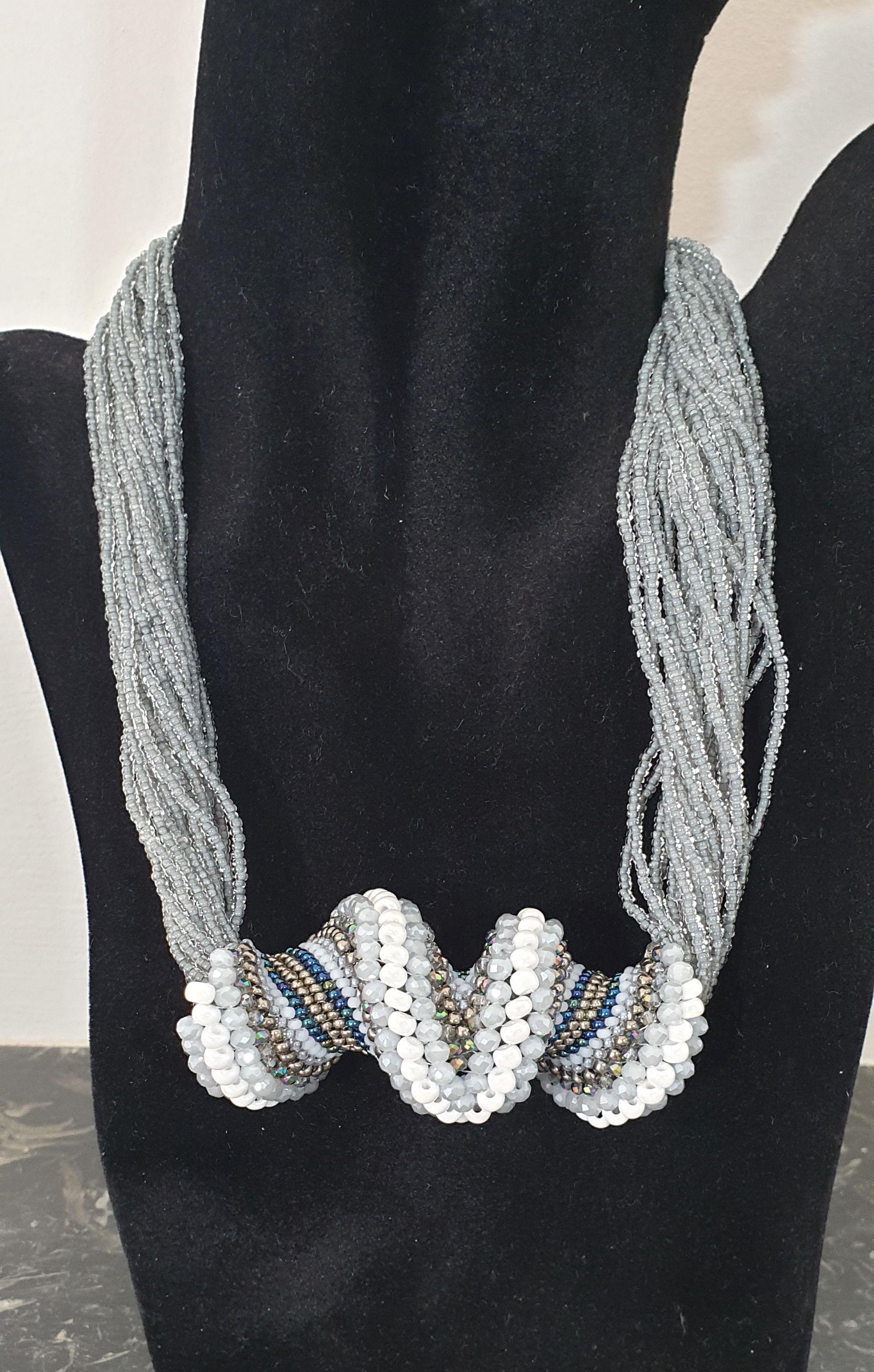 Gray, white & blue tones multi strands Murano glass beads fashion necklace.
Unique hand made by artist Paola B.  in Venise,  Italy, 2010s.
Made of: hand colored Murano glass beads, silver micro beads, and Swarovski cut glass beads.
The artist is a