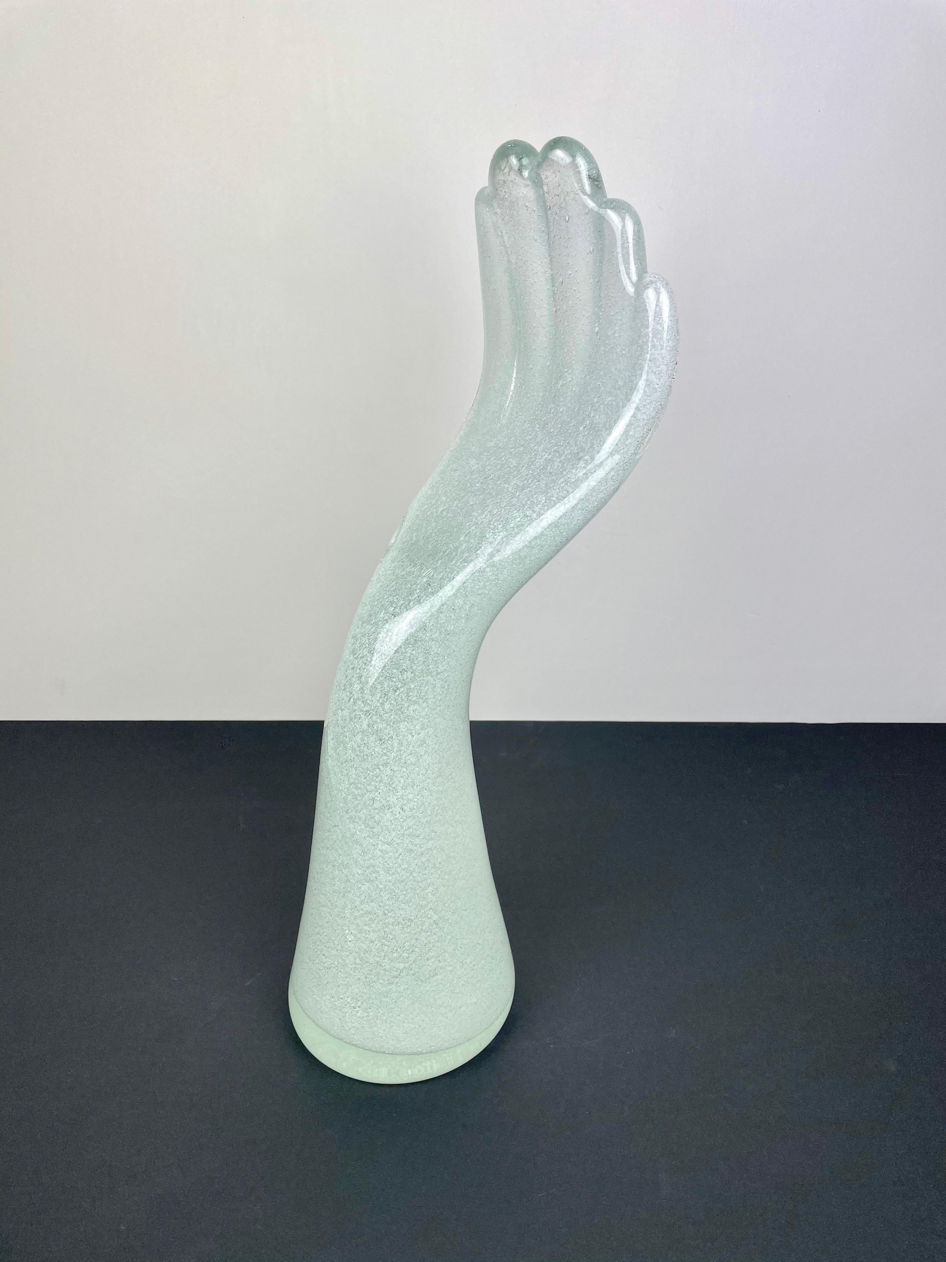 Big elegant sculpture in Murano glass in the shape of a human hand by the Italian artist Vistosi. His signature is engraved on the bottom of the sculpture as shown in pictures.