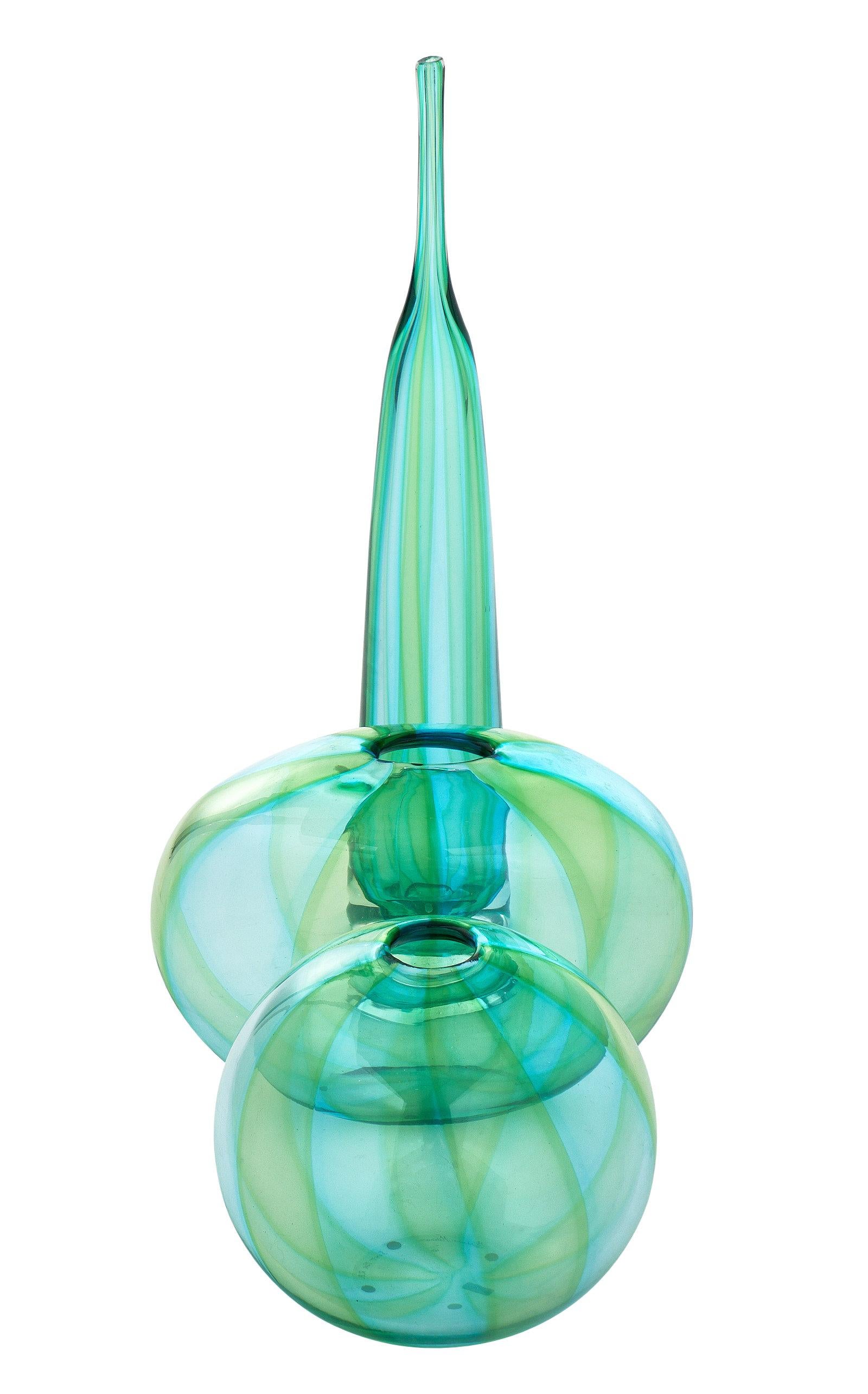 Handblown Murano glass trio. This dynamic Murano vessel trio combines swirling shades of aqua and green glass. We love the shapes and beautiful, unique details.

The measurements listed are for the tall vase. The medium vase is 9.875” in height,