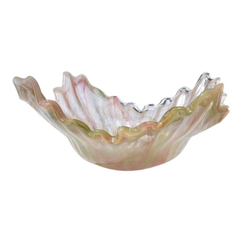 Beautiful large transparent Murano glass vessel. The rim of this piece is scalloped in varying heights. Giving the illusion of a draped piece of cloth. The colors are spectacular. With veining in pink and pale green marbling. A beautiful piece to be