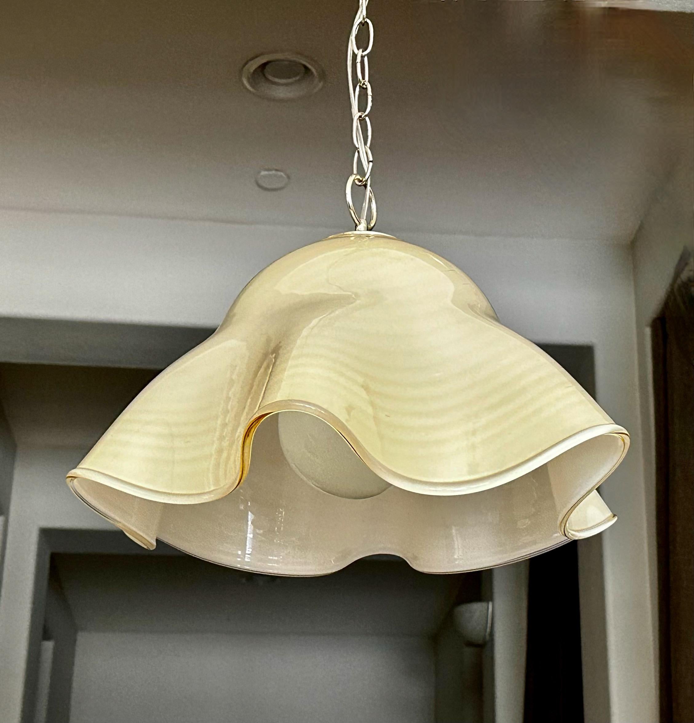 Italian Murano handkerchief shaped pendant ceiling light with chrome hardware. Murano cased glass body is creamy pale butterscotch with subtle slightly darker stripes. Uses regular A base bulb. Perfect for hall, entry or breakfast eating area.