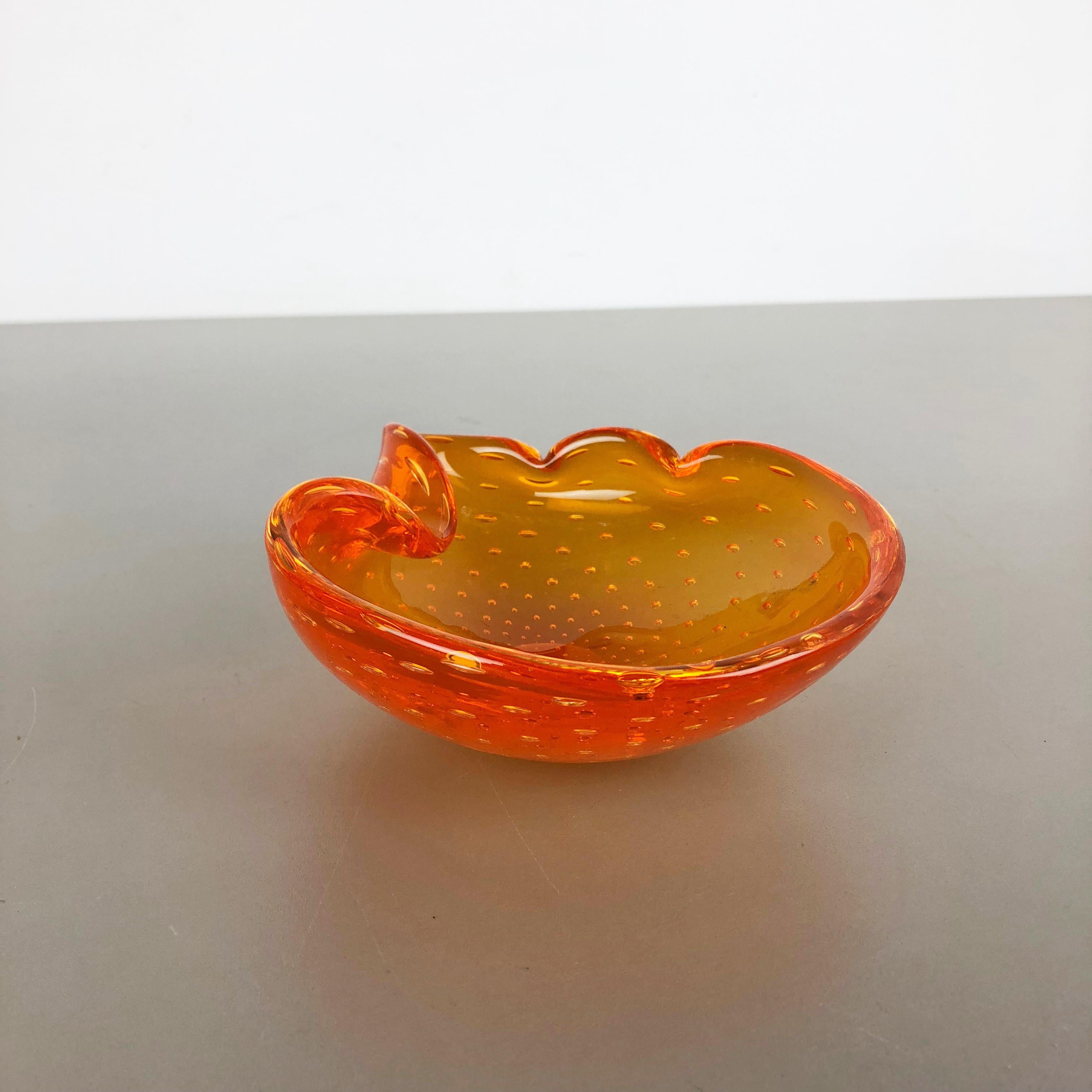 Article:

Murano glass bowl, ashtray element


Origin:

Murano, Italy


Producer:

Seguso dalla Venezia (SDV).


Decade:

1970s



This original vintage glass bowl element, ash tray was produced in the 1970s in Murano, Italy. It is made in Murano