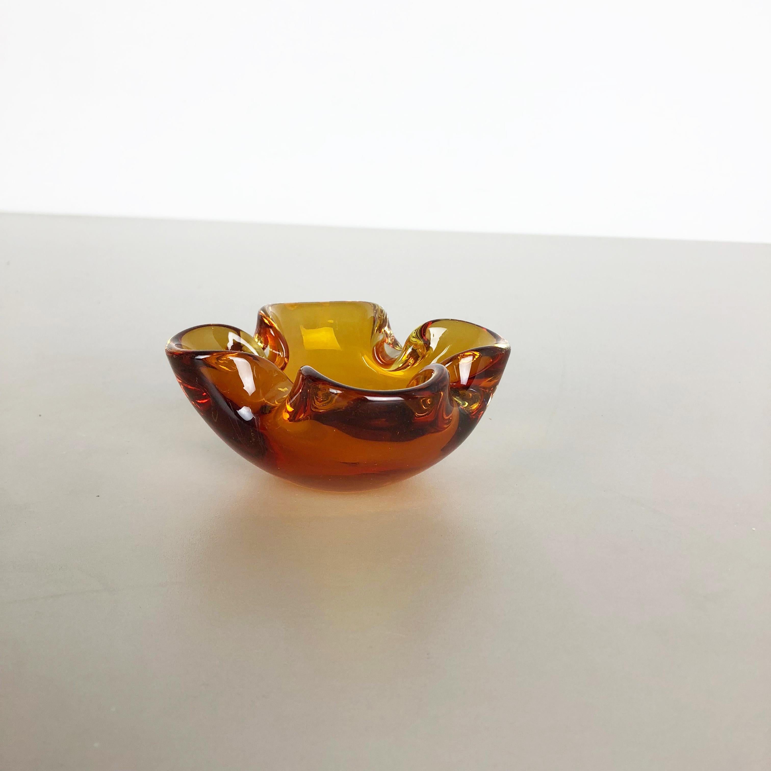 Article:

Murano glass bowl, ashtray element


Origin:

Murano, Italy


Decade:

1970s



This original vintage glass bowl element, ashtray was produced in the 1970s in Murano, Italy. It is made in Murano technique and has a