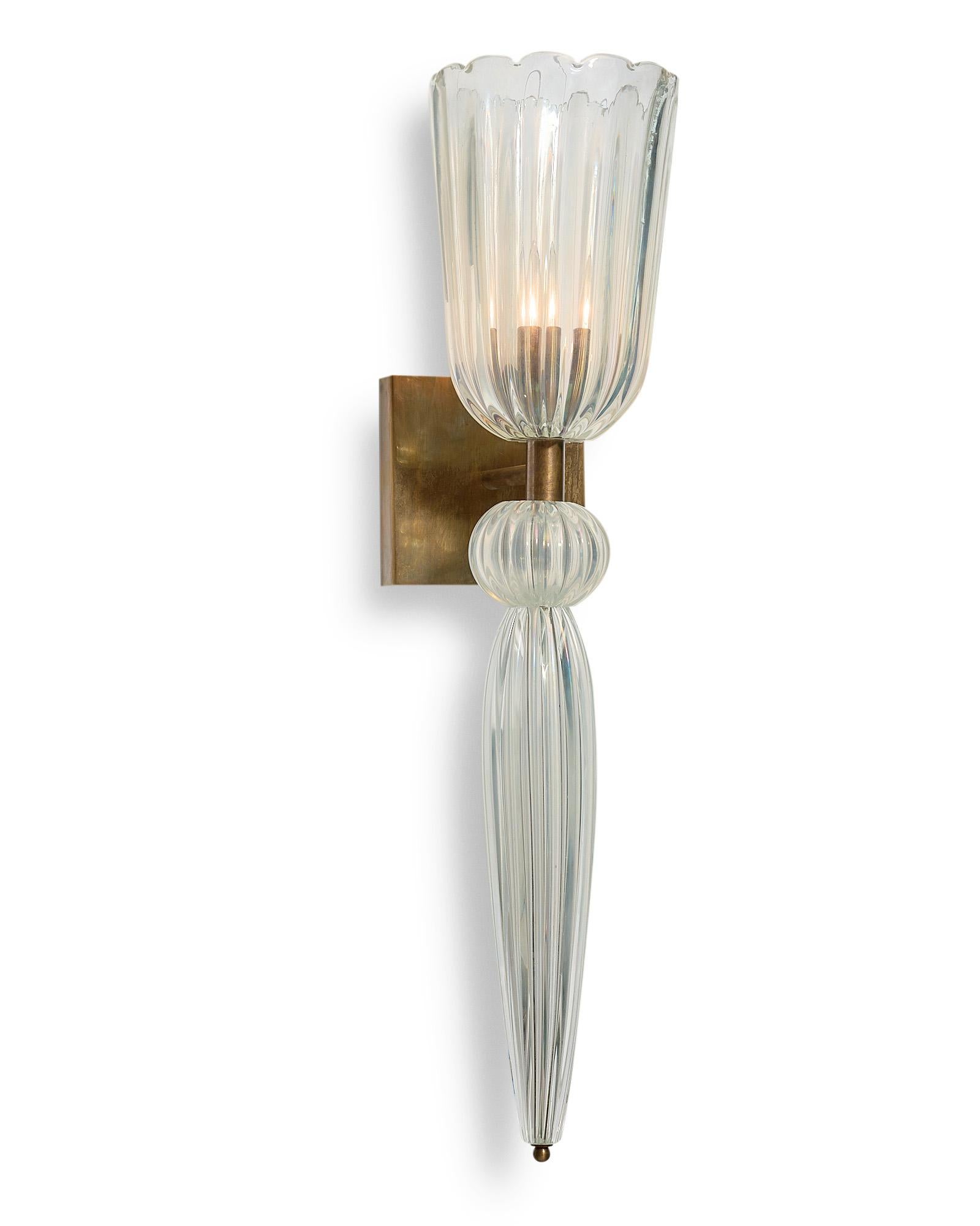 Pair of sconces, Italian, from the island of Murano. This hand blown pair has a beautiful iridescent finish to the glass and is supported on brass structures. They have been newly wired to fit US standards.

This pair is a special order from our