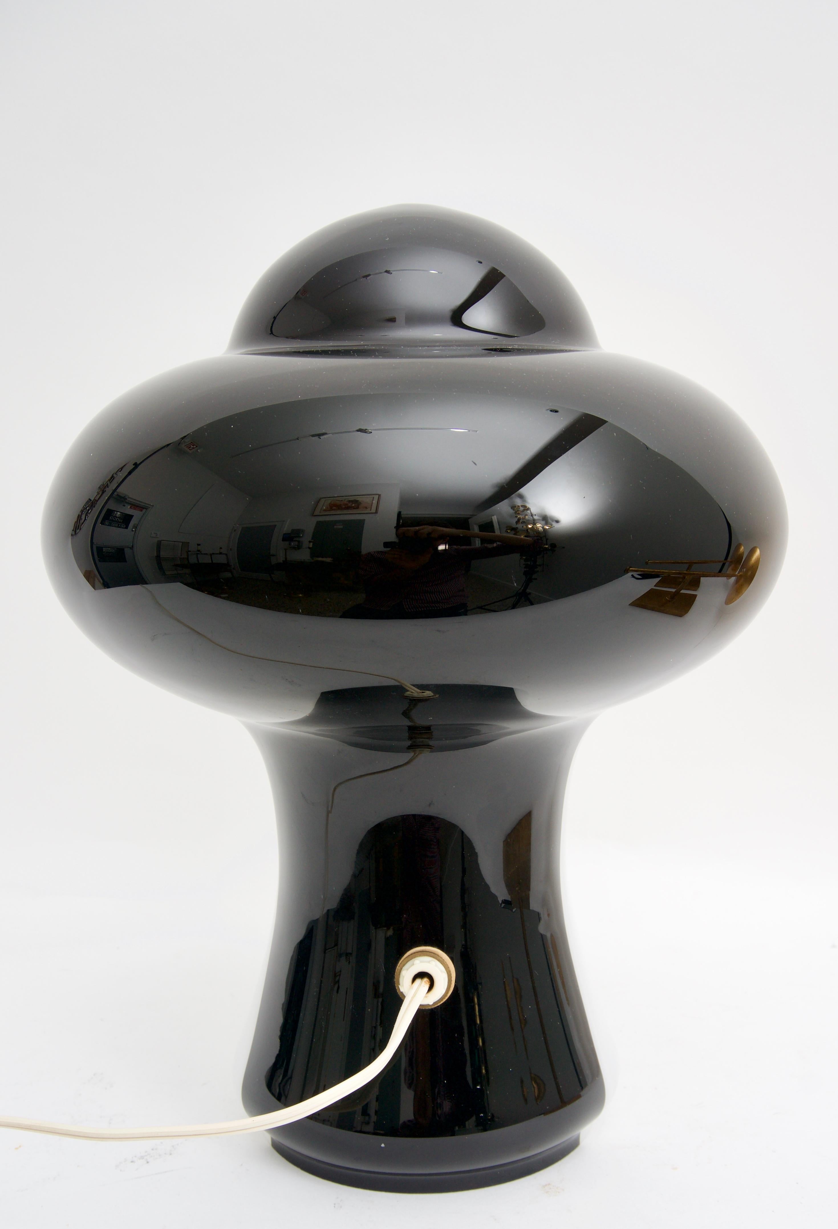 This stylish Murano glass lamp was acquired from an estate in London, England and dates to the 1960s-1970s. With its mod black and white coloration it definitely makes a statement.

Note: The plug is wired for US sockets.