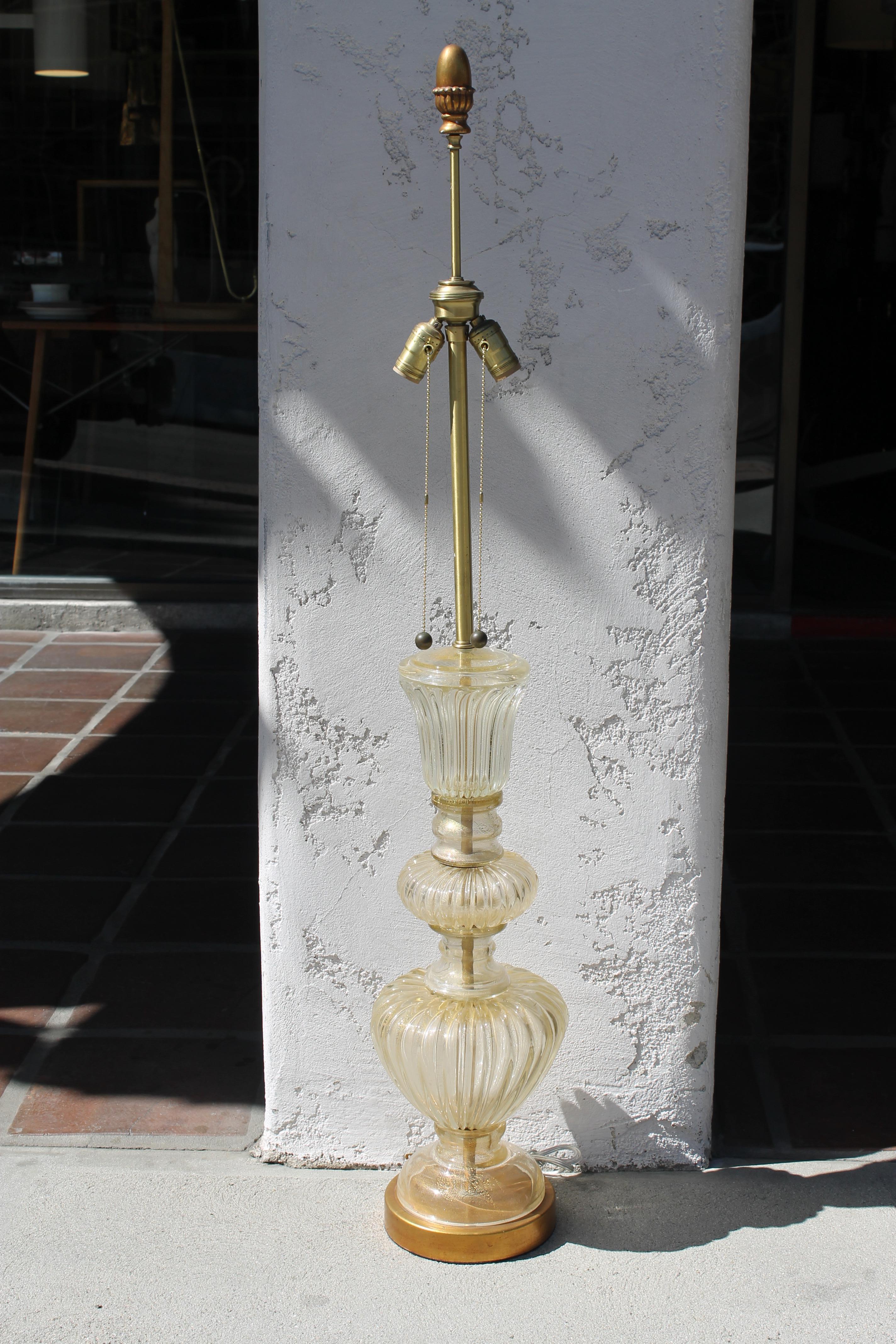 Murano glass lamp by the Marbro Lamp Company of Los Angeles, CA. Clear glass with gold flecks throughout. Lamp has been professionally rewired. Lamp measures 50