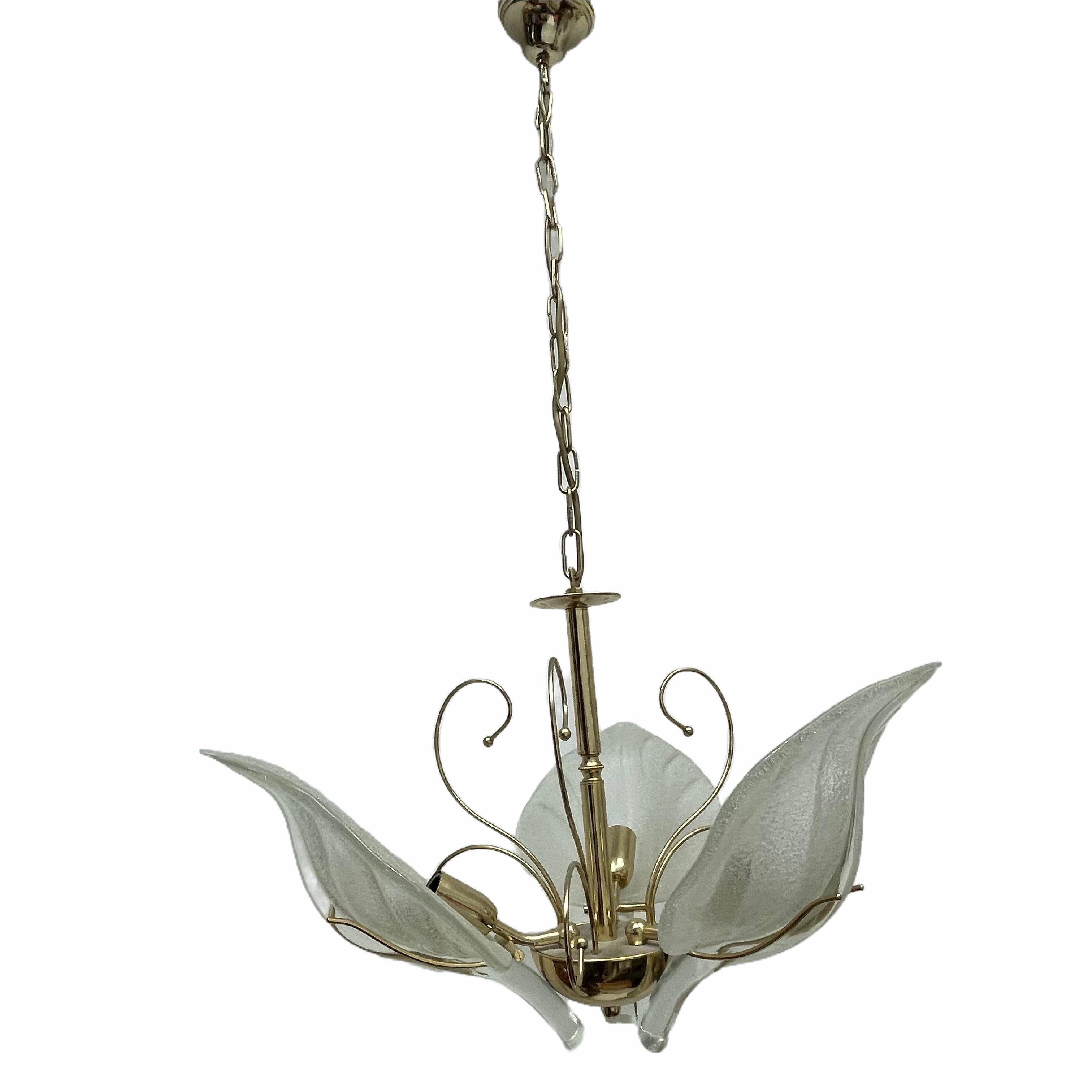 Beautiful and rare chandelier or pendant light by Massive Leuchten, Germany. An original vintage piece manufactured in the 1960s. It is made of metal and three heavy blown Murano glass leafs. The Fixture requires 3 European E14 / 110 Volt Candelabra