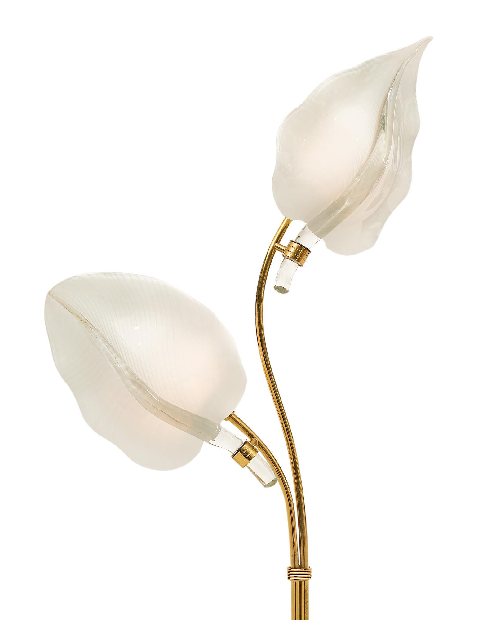Floor lamp, Italian, the stem is brass, two large Murano glass leaves are featured hiding sockets and two bulbs. One of the leaves has been professionally restored. It has been newly wired to fit US standards.