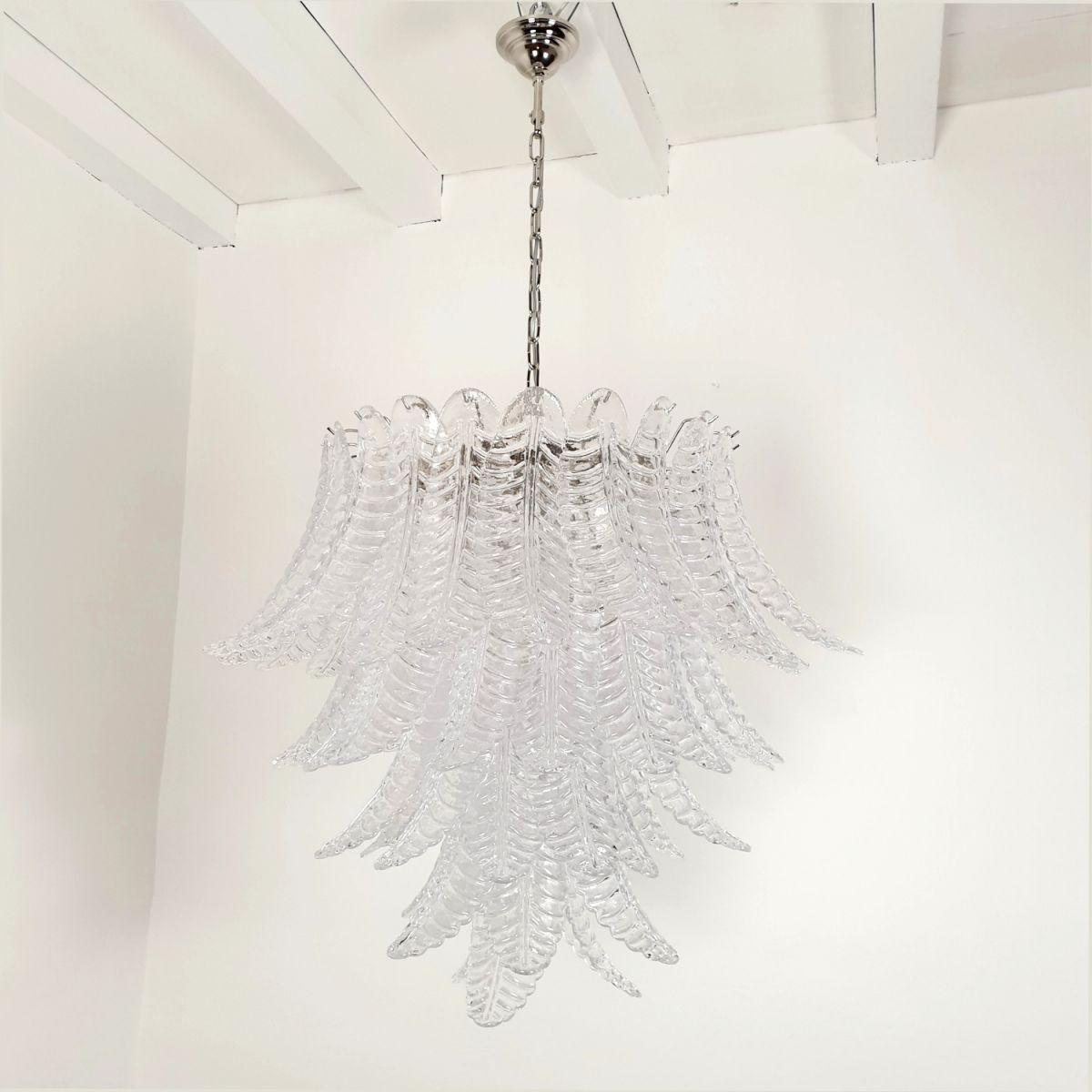 Large Mid Century Modern Murano glass chandelier, attributed to Mazzega, Italy 1970s.
The vintage chandelier is made of transparent Murano glass leaves and a chrome frame.
The Murano glass leaves are translucent.
The glasses are hand blown with a