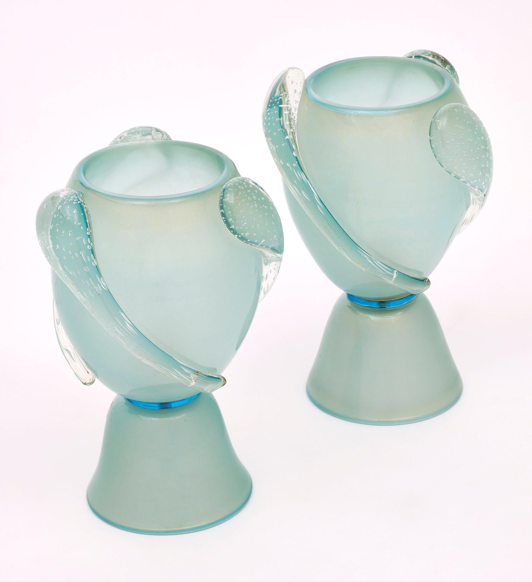 Pair of lamps from the island of Murano made of hand-blown glass in a light blue color with an aquamarine ring. This pair has been newly wired to fit US standards.