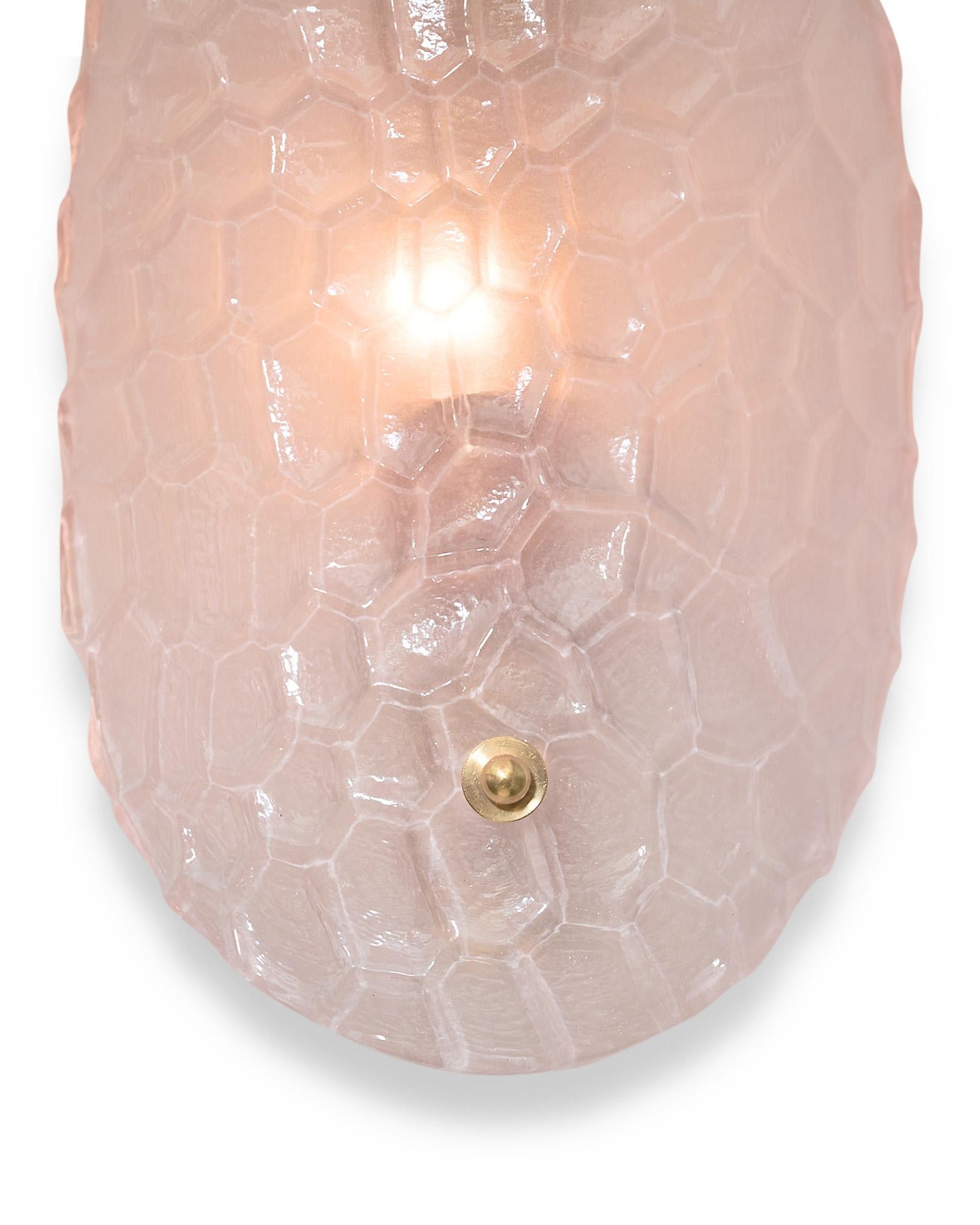 Pair of sconces, Italian, from the island of Murano outside of Venice. This hand-blown pair is made of light pink glass with a “battuto” hammered texture and brass finials. They have been newly wired to fit US standards.