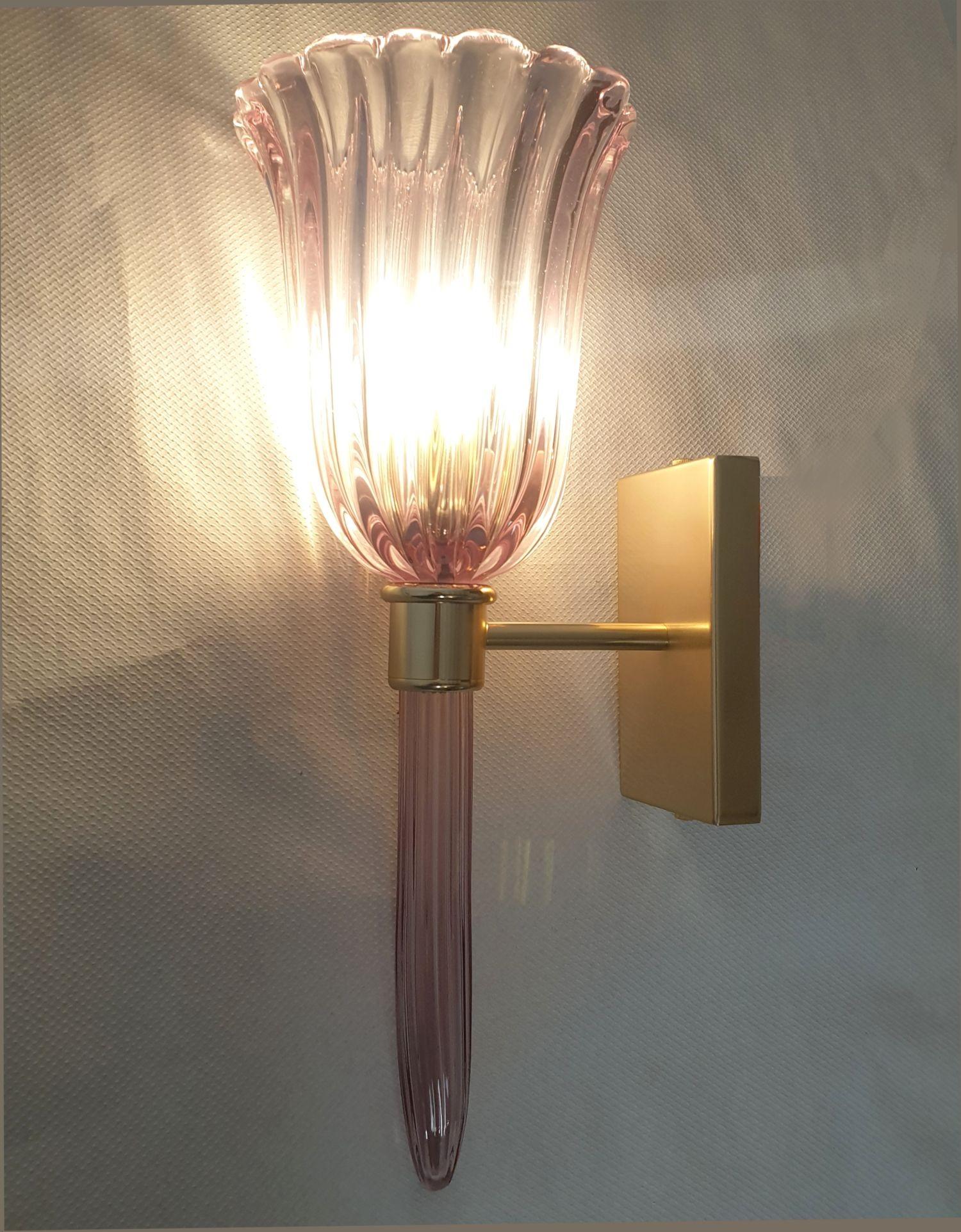 Pair of Neoclassical Handmade Murano glass sconces, attributed to Venini, Italy 1980s.
The Murano glass is in a delicate lilac/purple color - it's thickness makes it translucent.
The mounts are gold plated. The back plate is: H 5.9 x W 3.54
