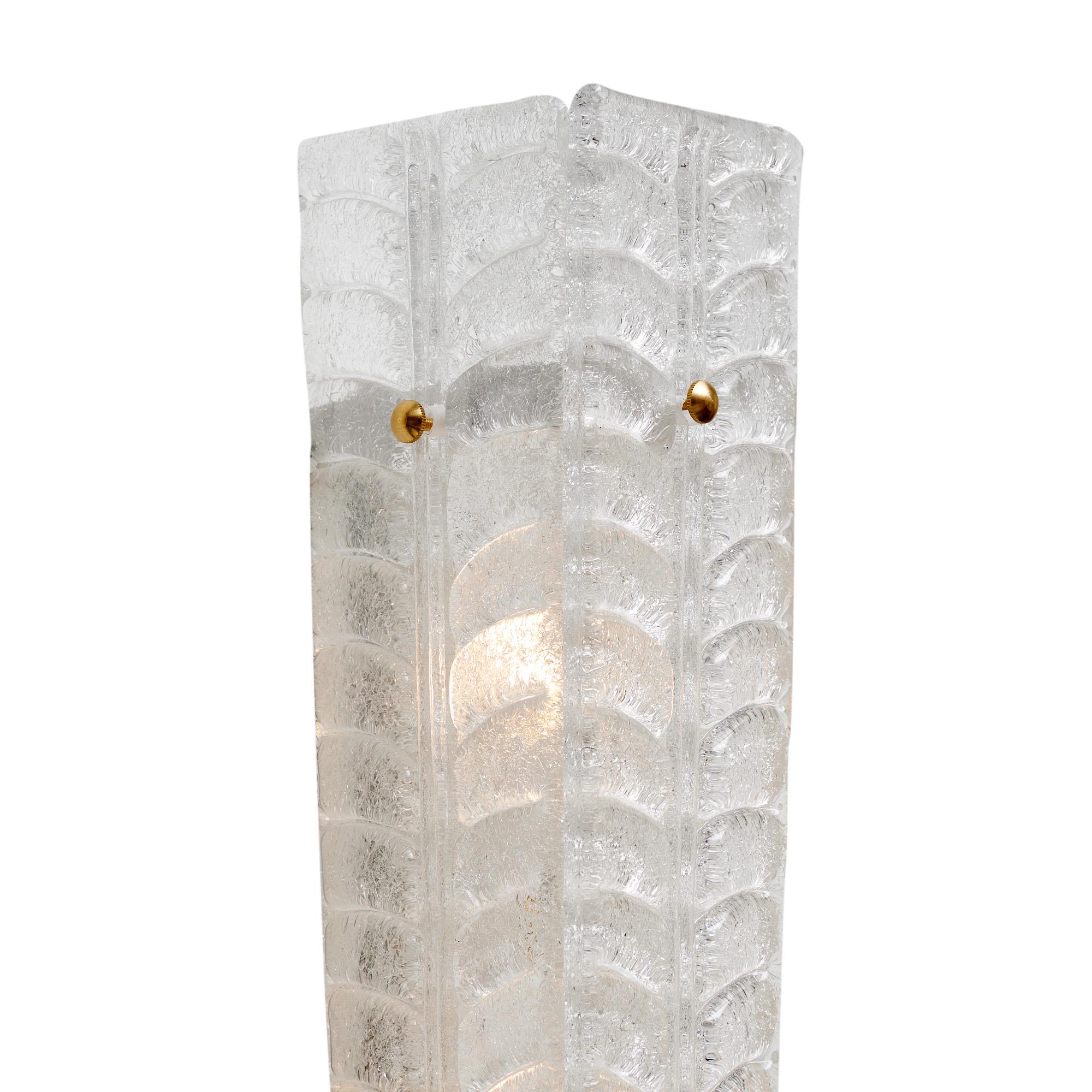 Pair of sconces from Murano, Italy outside of Venice. This pair is made of hand-blown glass pieces held in place on the brass structure with brass finials. Each piece has a lovely leaf-like design and graniglia technique creating texture. At the
