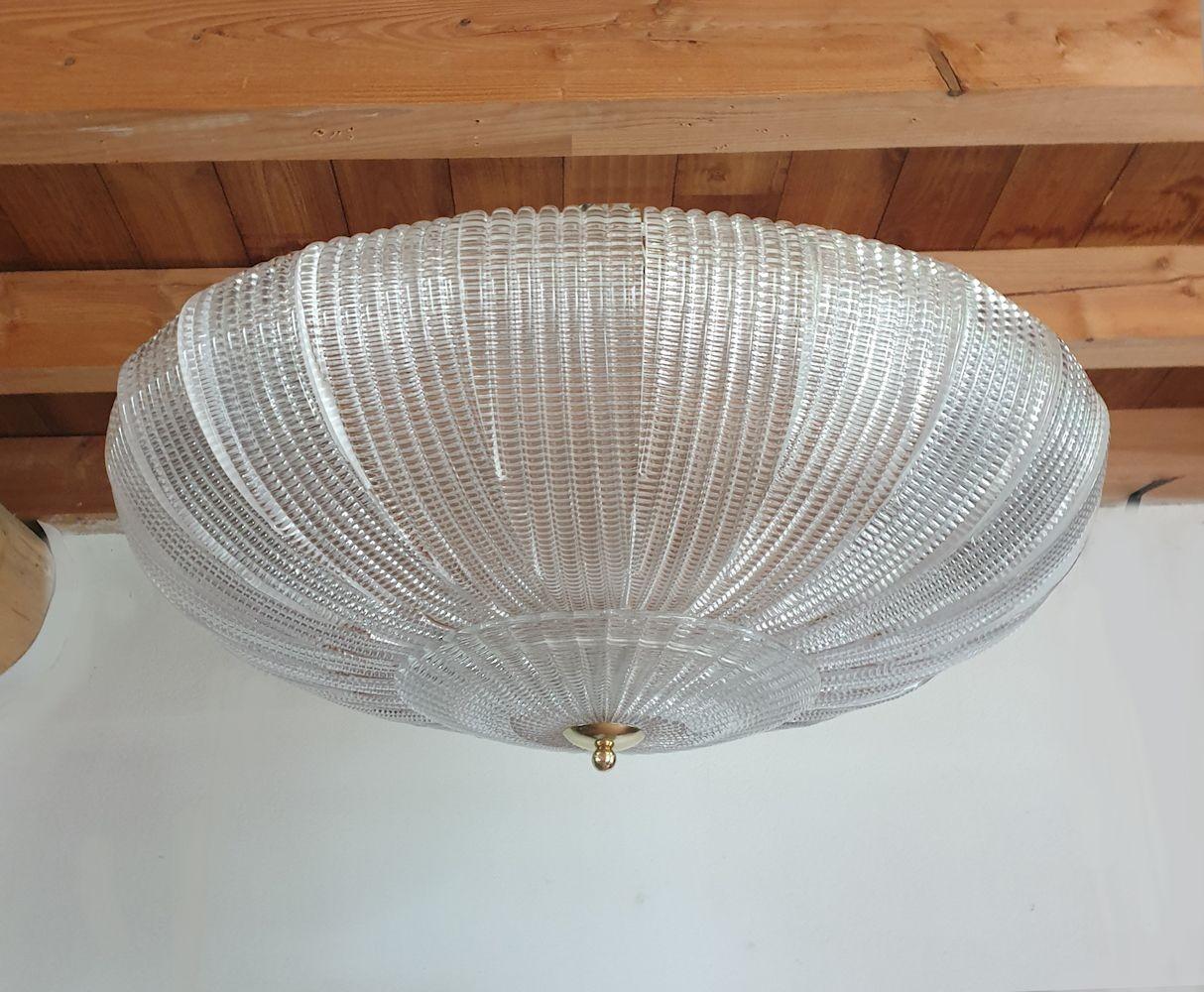 Mid Century Modern large flush mount chandelier, by Mazzega Murano, Italy 1980s.
Two chandeliers available - set of two. Priced and sold individually.
To inquire about the pair, select 2 items.
The large vintage flush mount is made of clear Murano