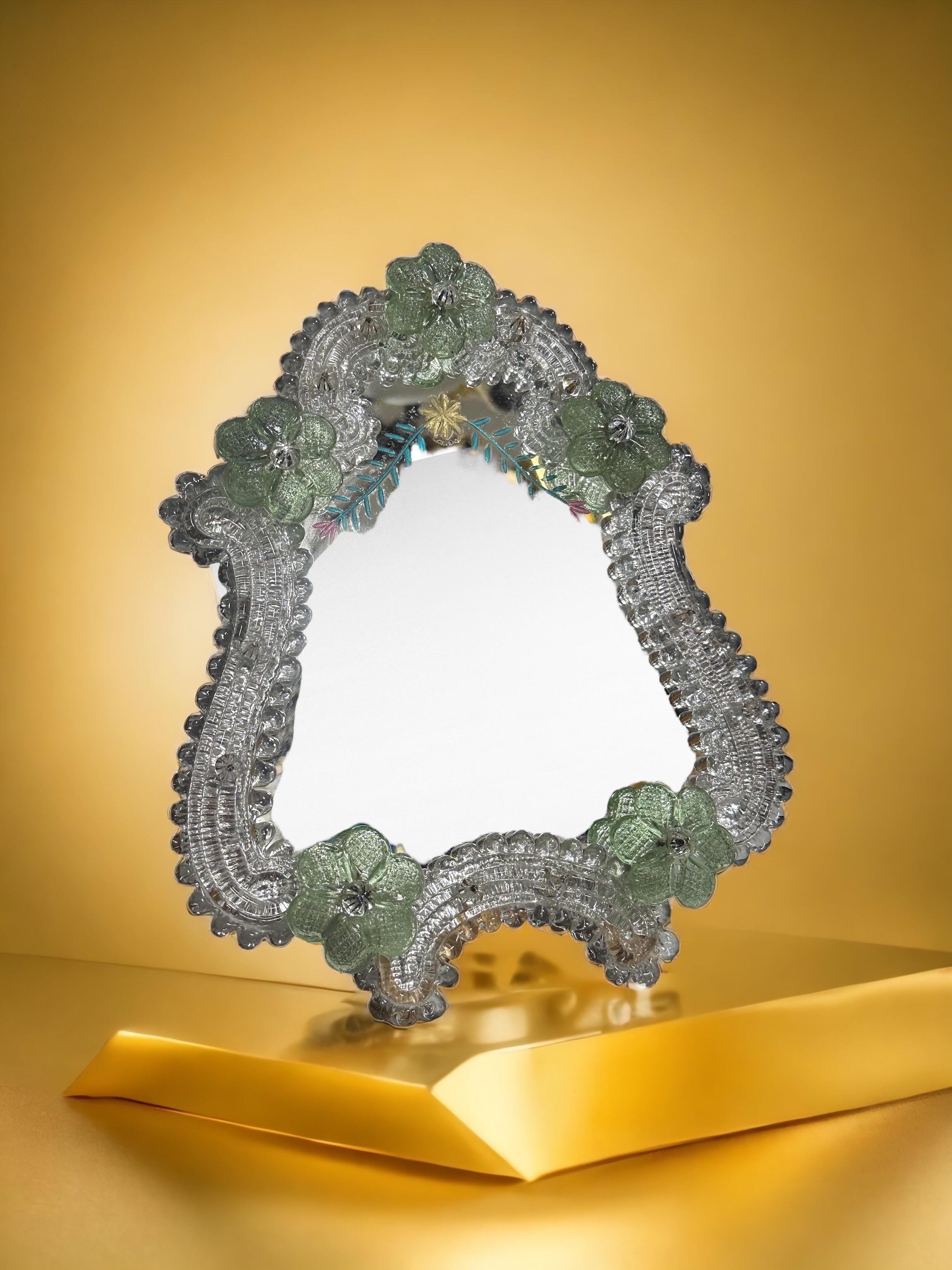 A gorgeous Murano glass vanity mirror surrounded with handmade glass flowers. With minor signs of wear as expected with age and use. A nice addition to any dressing room. Can be used as Wall Mirror or standing Mirror on a cupboard in a dressing room.
