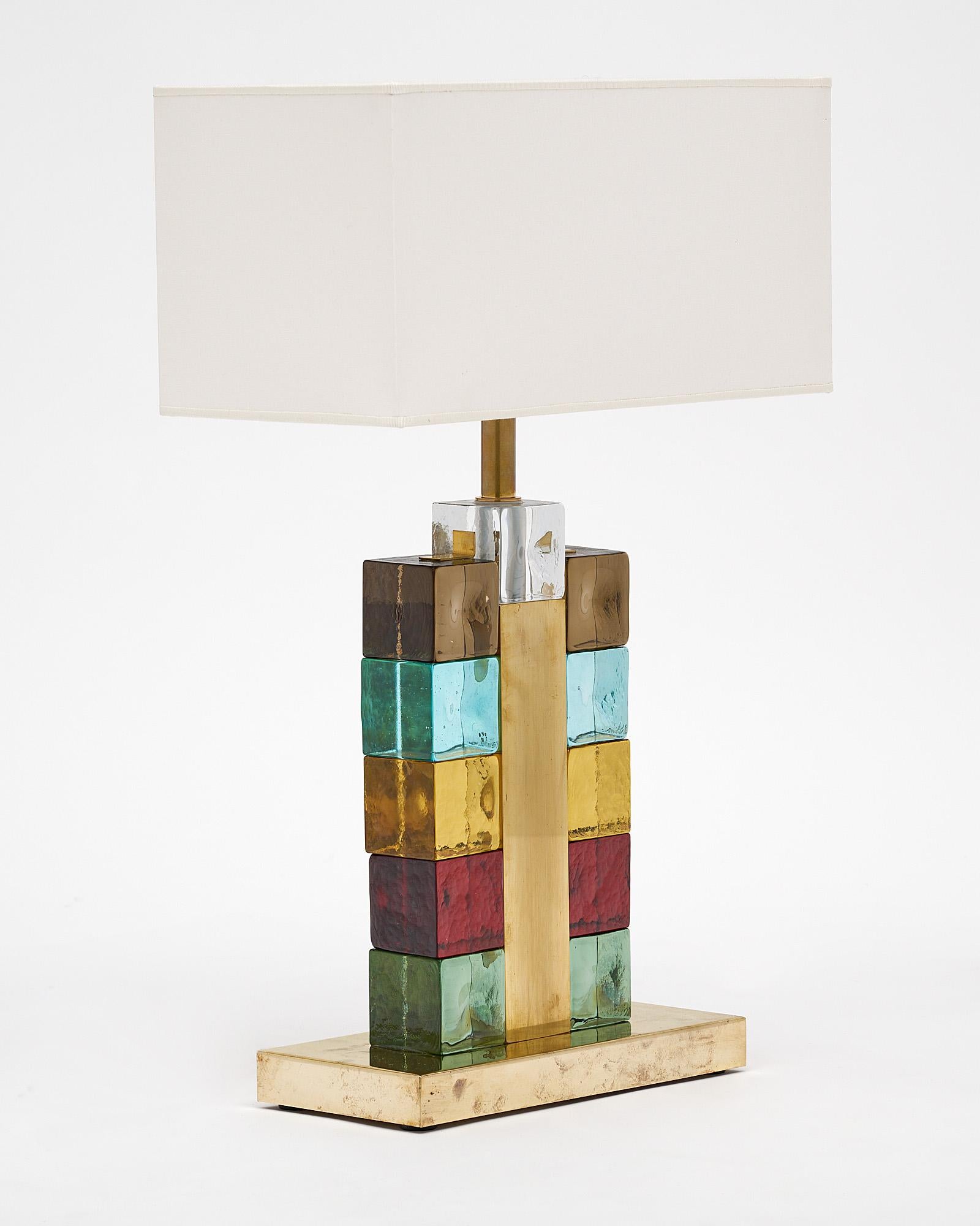 Pair of Italian Murano glass lamps with a polished brass structure. The lamps feature an array of multicolored Murano glass cubes.