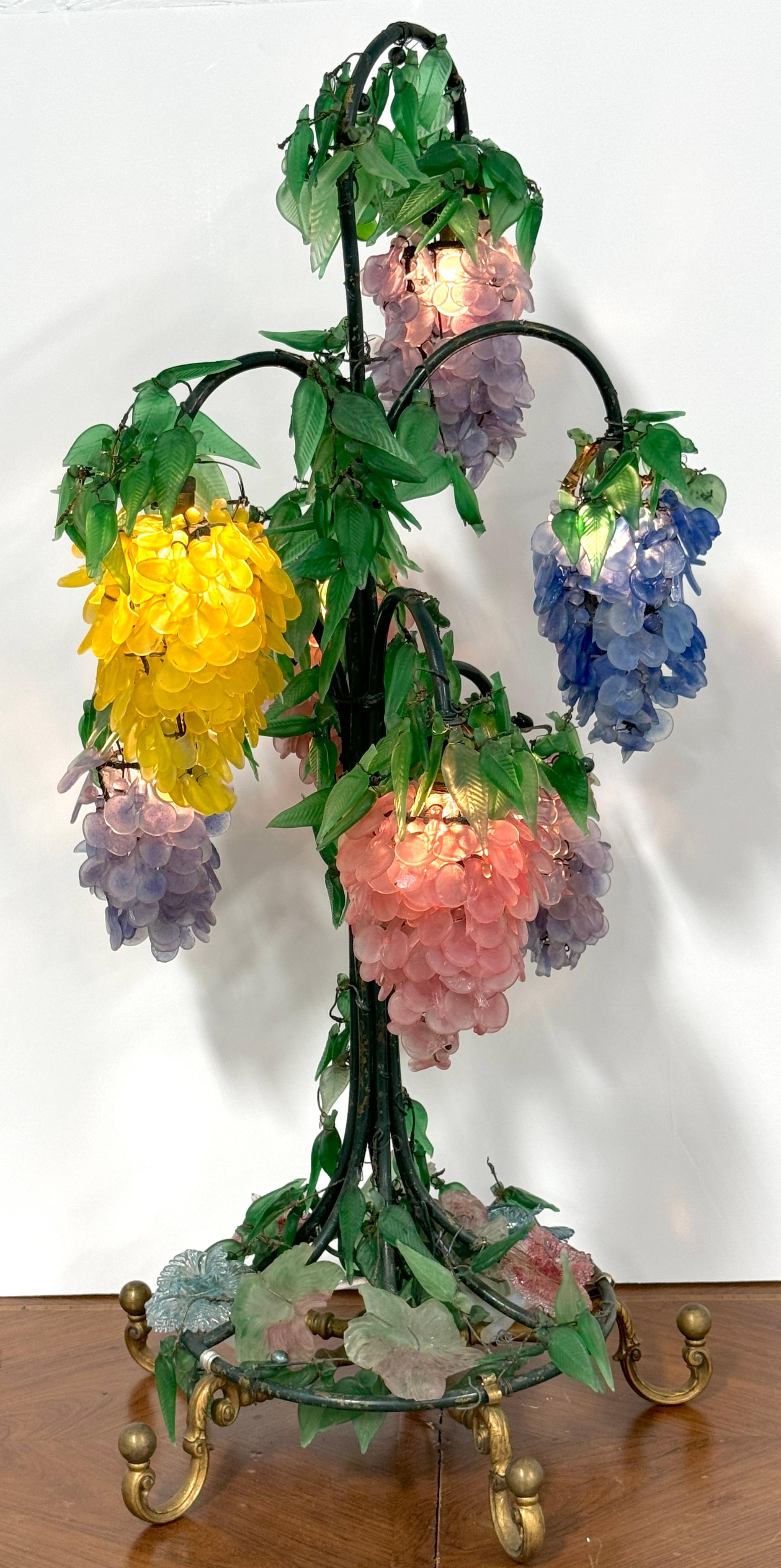 Murano Glass Multi-Colored Wisteria 7-Tiered Table Lamp, 
Italy, circa 1950s

This monumental Murano glass table lamp, made in the 1950s, is a masterwork of intricate glass artistry, standing an impressive 40 inches tall. Unlike typical Murano